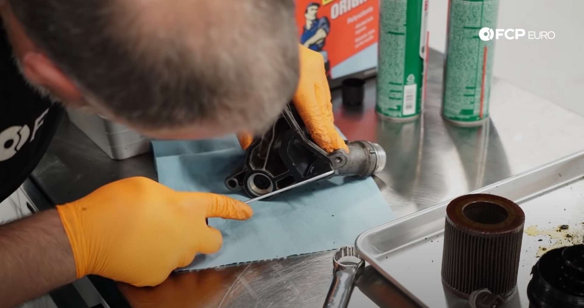 DIY BMW E9X Oil Filter Gasket Replacement removing the old oil filter housing gasket