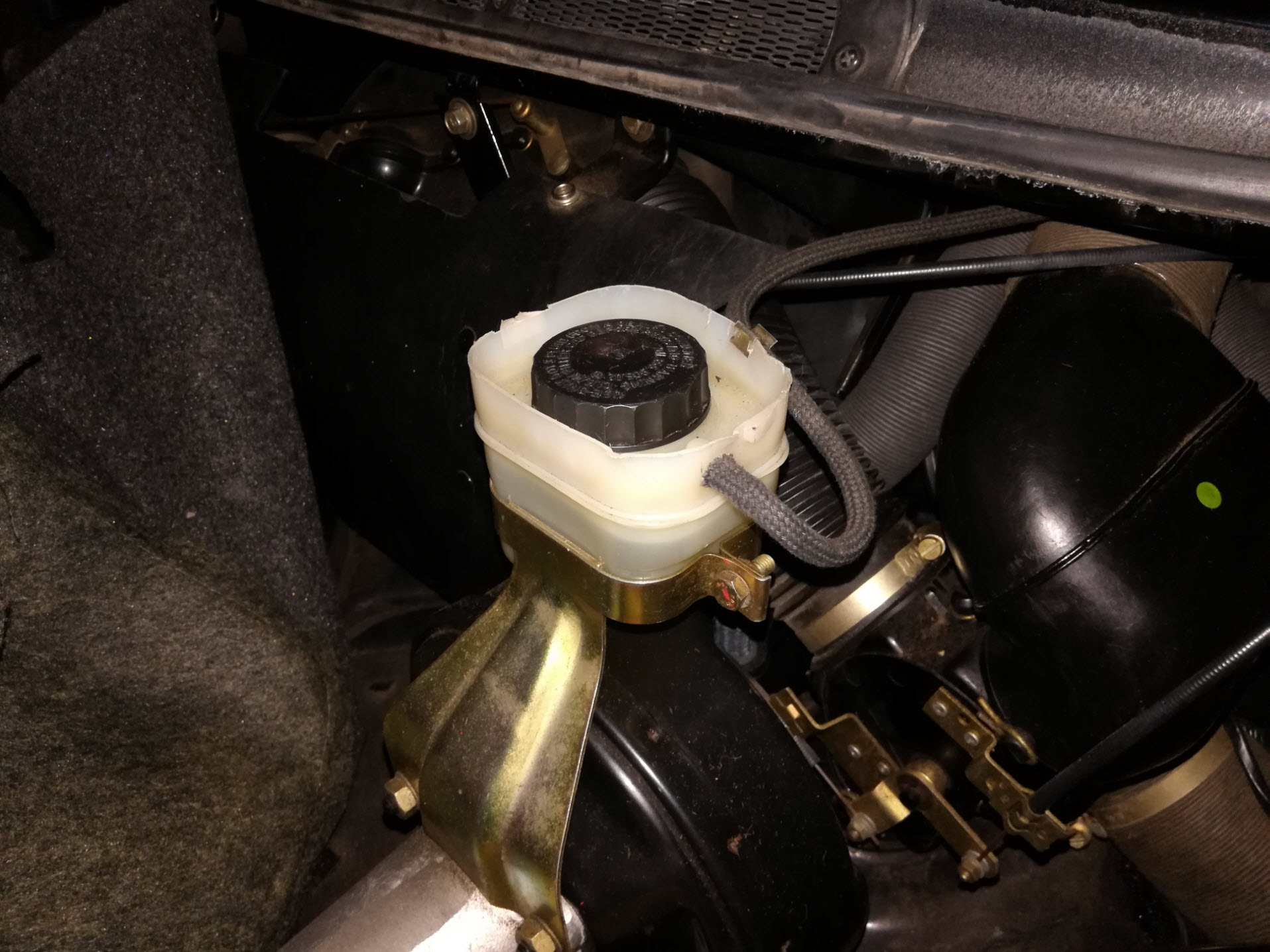 Air-cooled Porsche 911 brake fluid reservoir.