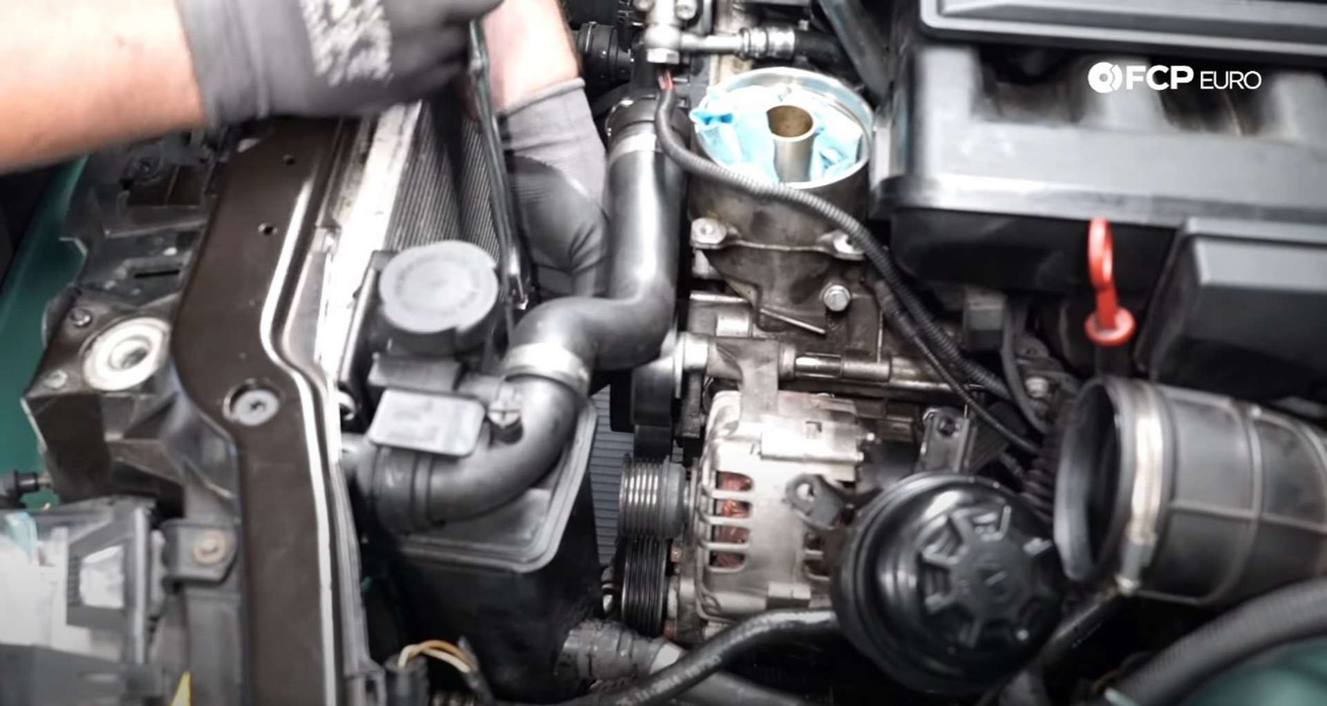 DIY BMW E46 Oil Filter Housing Gasket and VANOS Line Replacement installing the belt idler