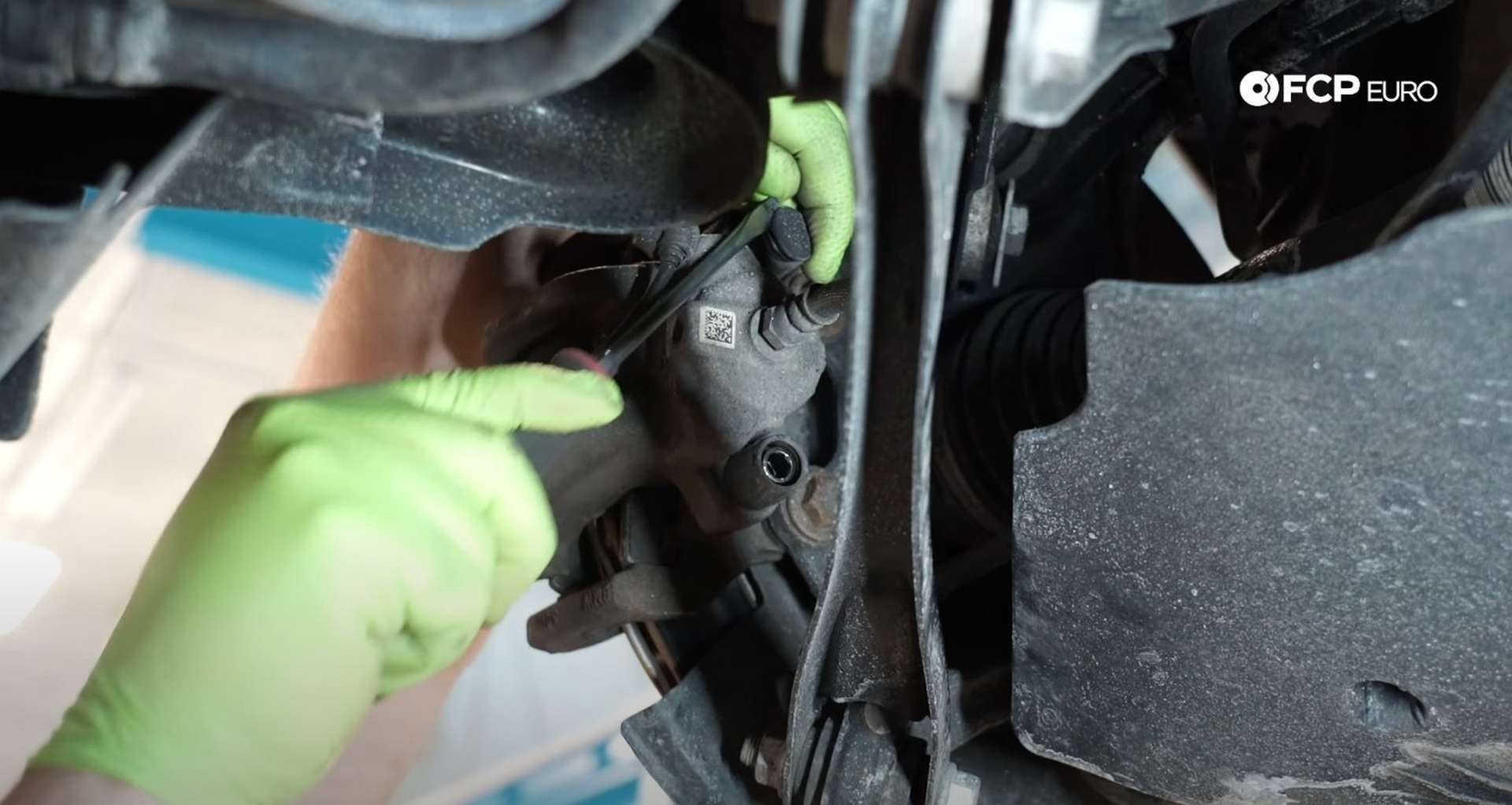 DIY BMW F30 Rear Brake Service removing the caliper's dust caps