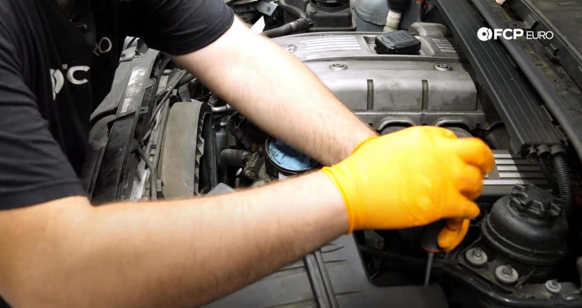 DIY BMW N52 Drive Belt Replacement loosening the intake hose clamp