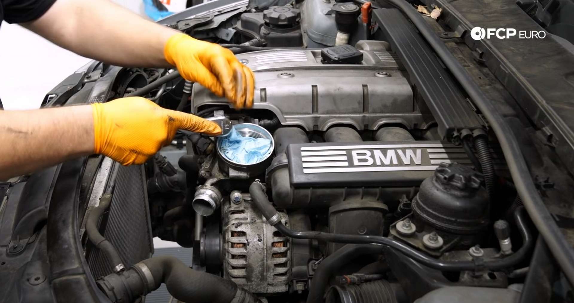 DIY BMW E9X Oil Filter Gasket Replacement removing the top mounting bolt