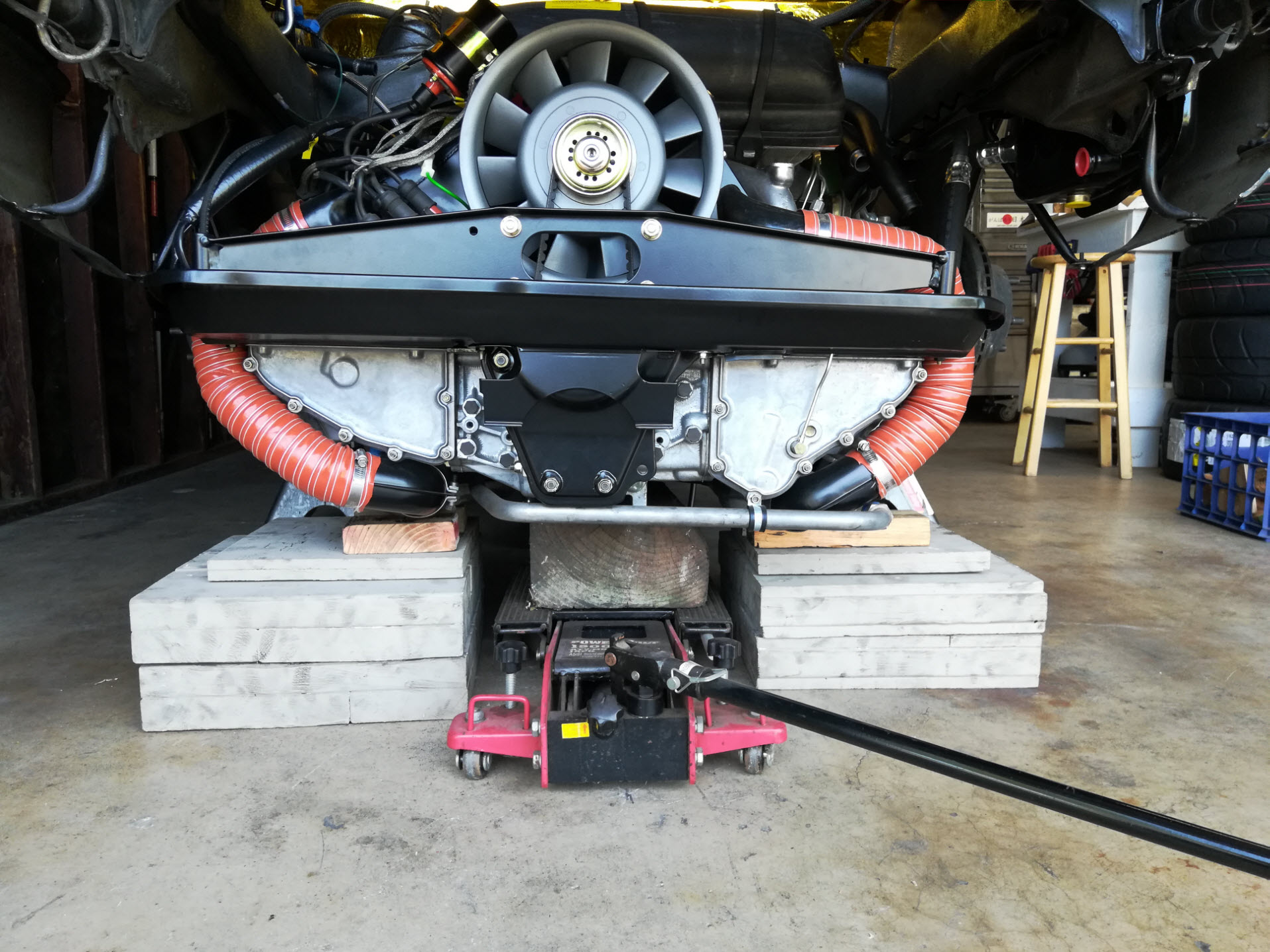 Air-cooled Porsche 911 engine drop with wood blocks.