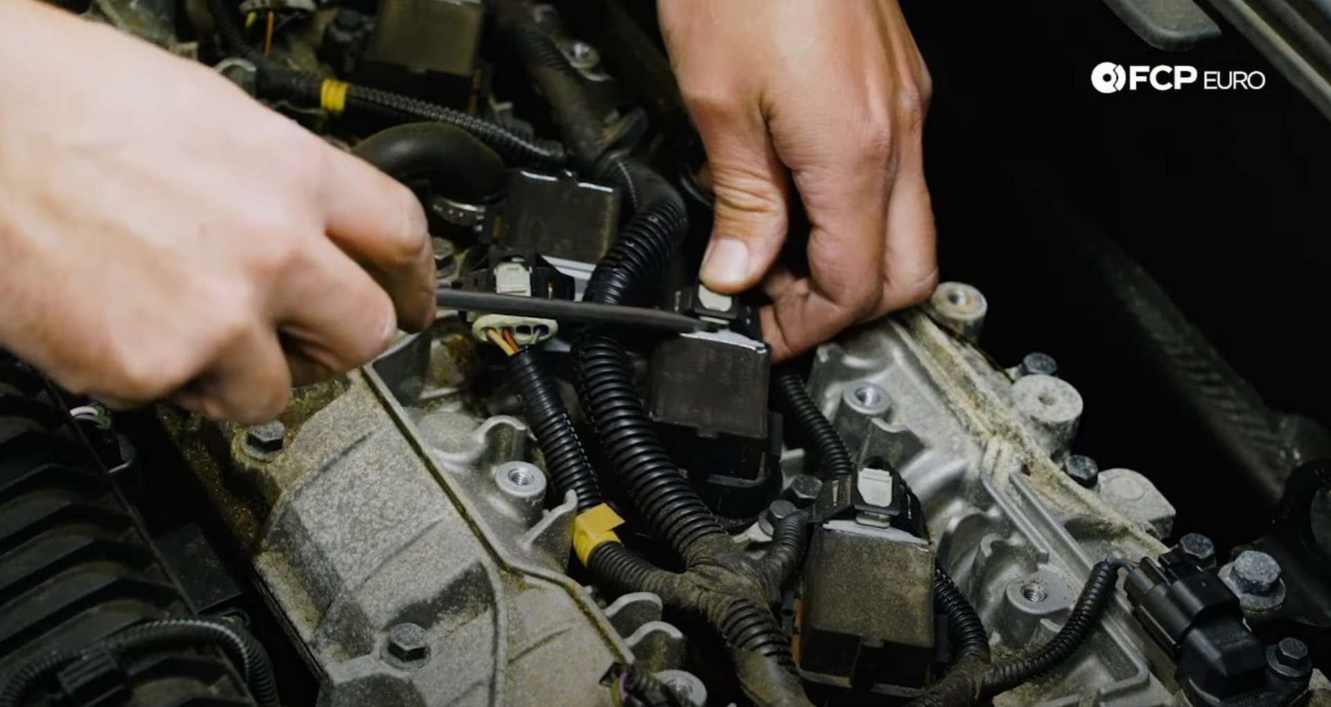 DIY Volvo Spark Plug and Ignition Coil Replacement unplugging the ignition harness