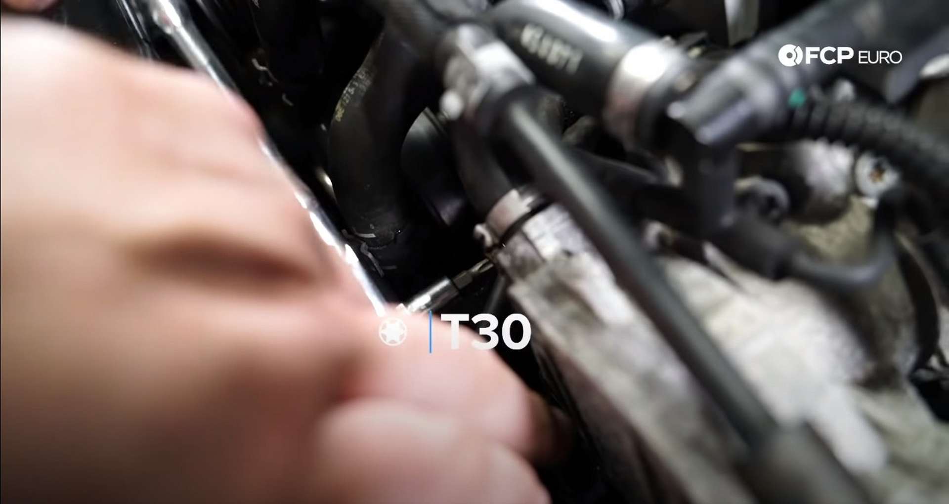 DIY Audi 3.0T Supercharger Oil Change installing the coolant line mounting bolt