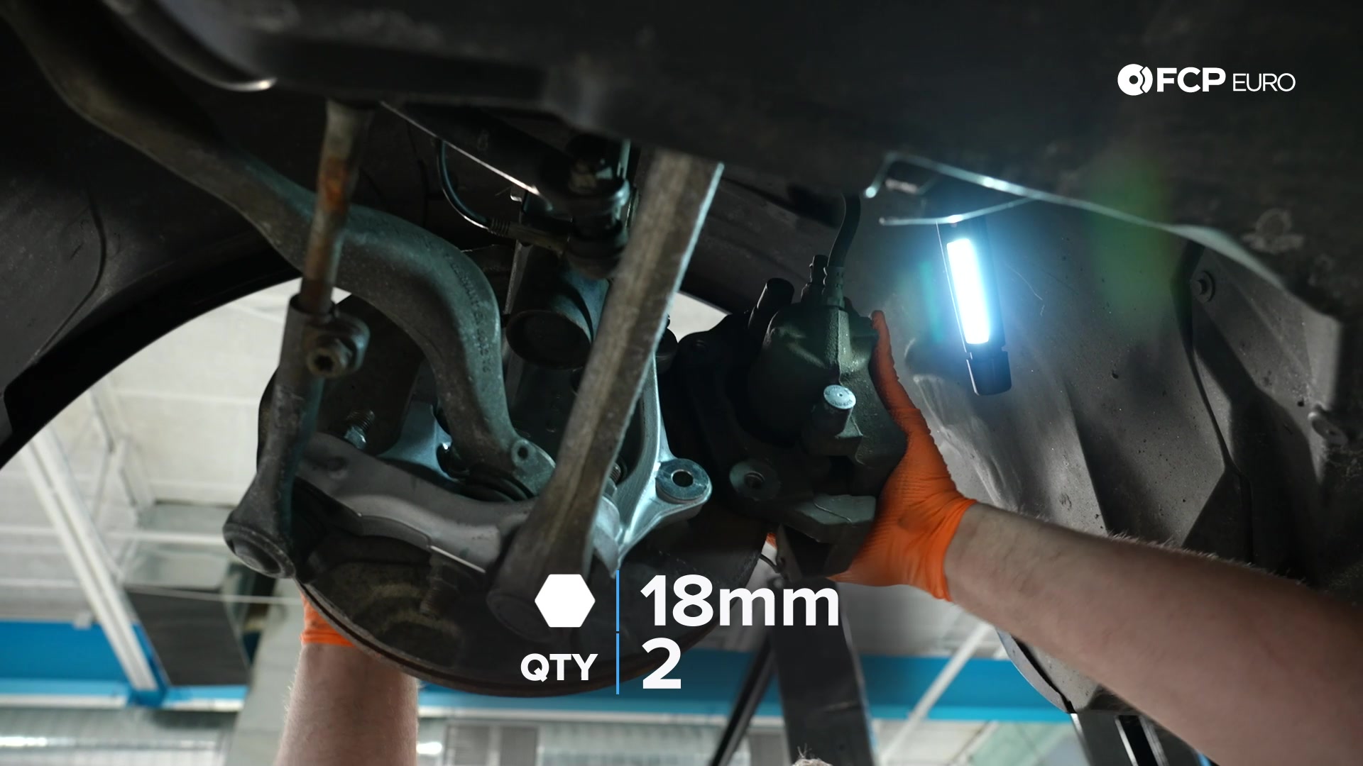 DIY BMW E90 Steering Knuckle Replacement tightening the dust shield’s bolts