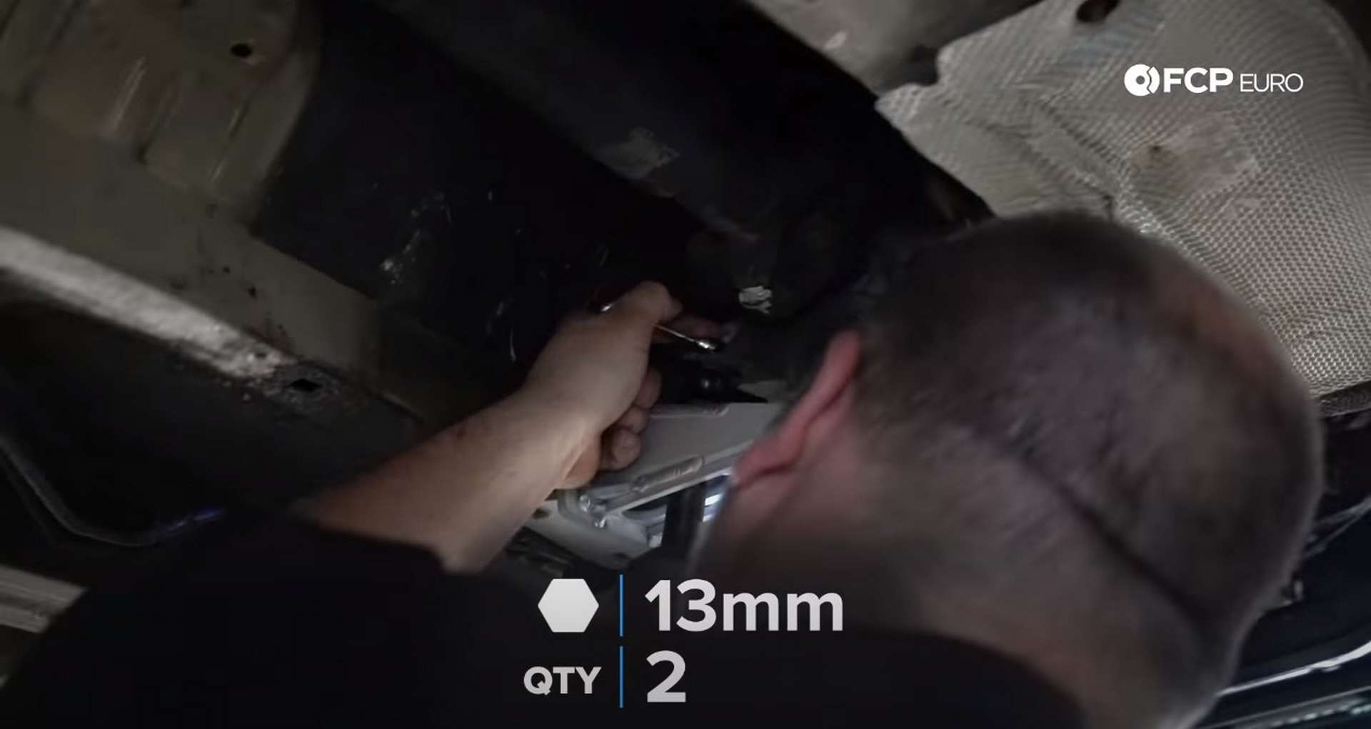 DIY BMW E46 Clutch Replacement separating the transmission from the crossmemeber