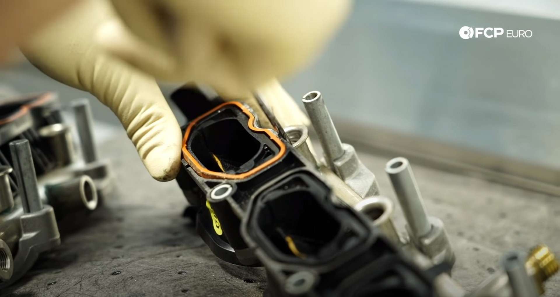 DIY Audi 3.0t Walnut Blasting Intake Valves removing the old fuel injector o-rings from the manifolds