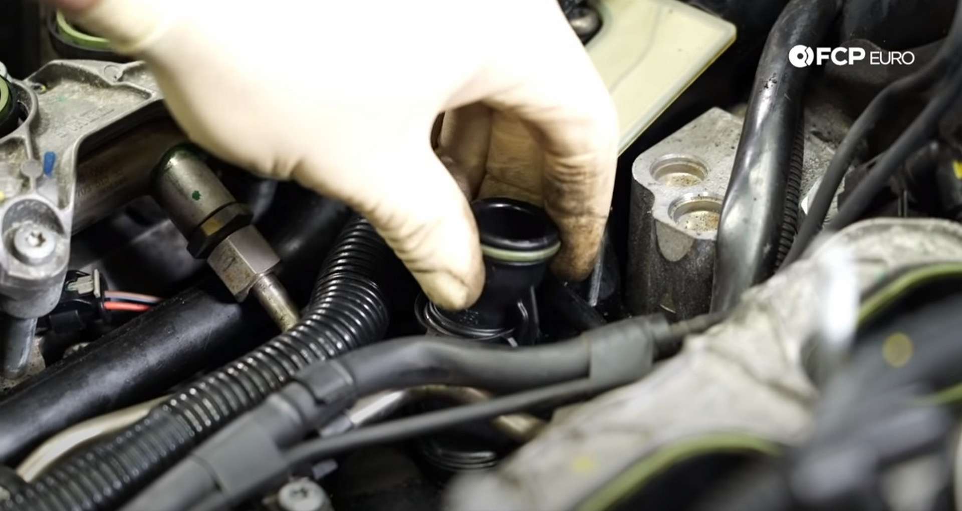 DIY Audi 3.0T Supercharger Oil Change installing the new breather pipe