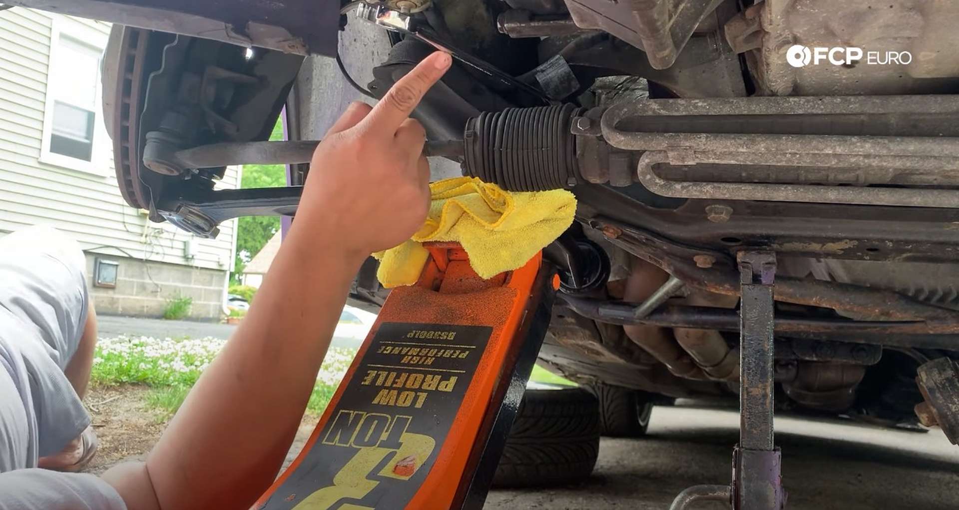 DIY BMW E36 Control Arm and Bushings using the jack to put pressure on the inner ball joint