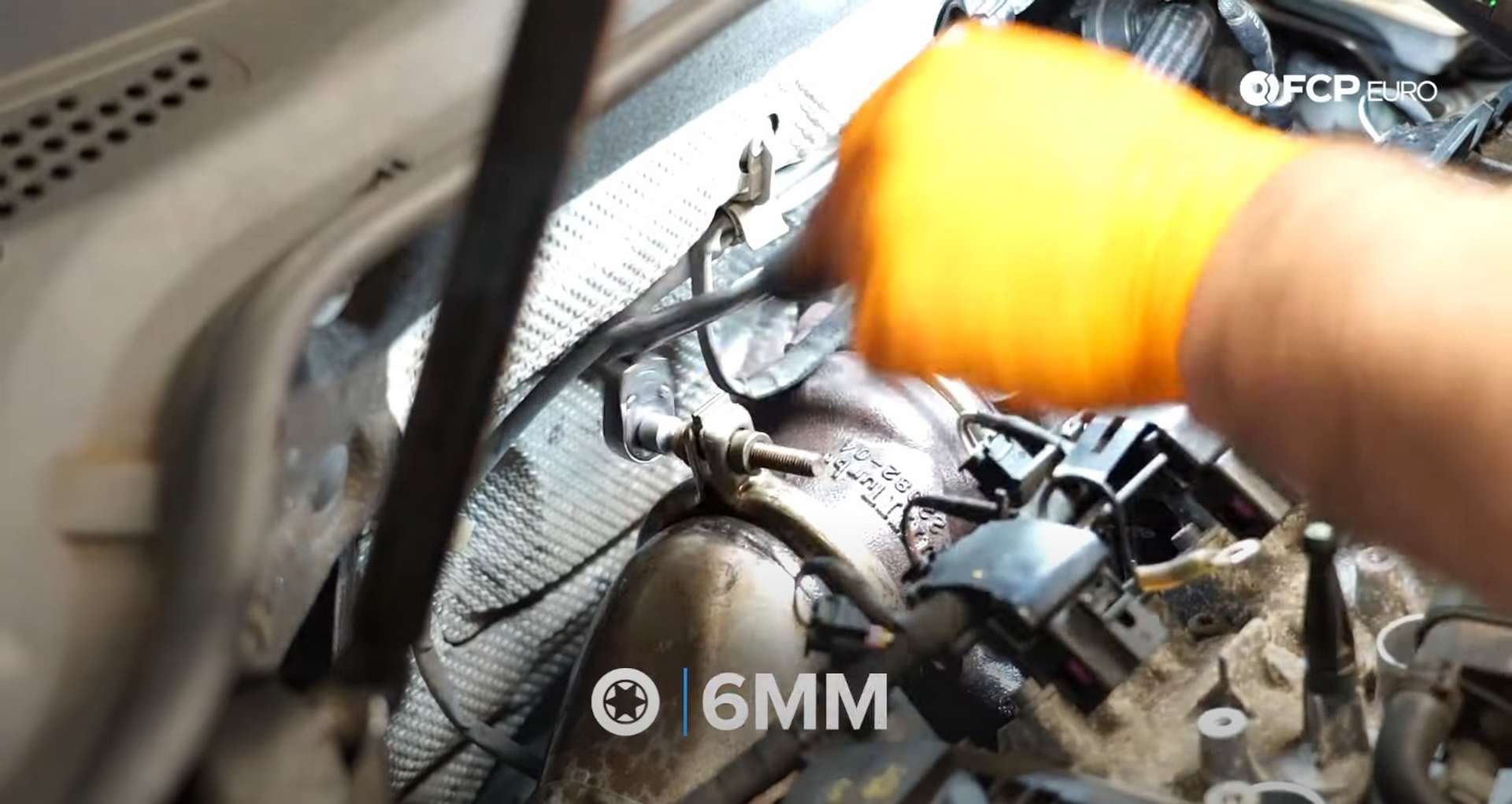 DIY MK7 VW GTI Turbocharger Upgrade unbolting the downpipe clamp