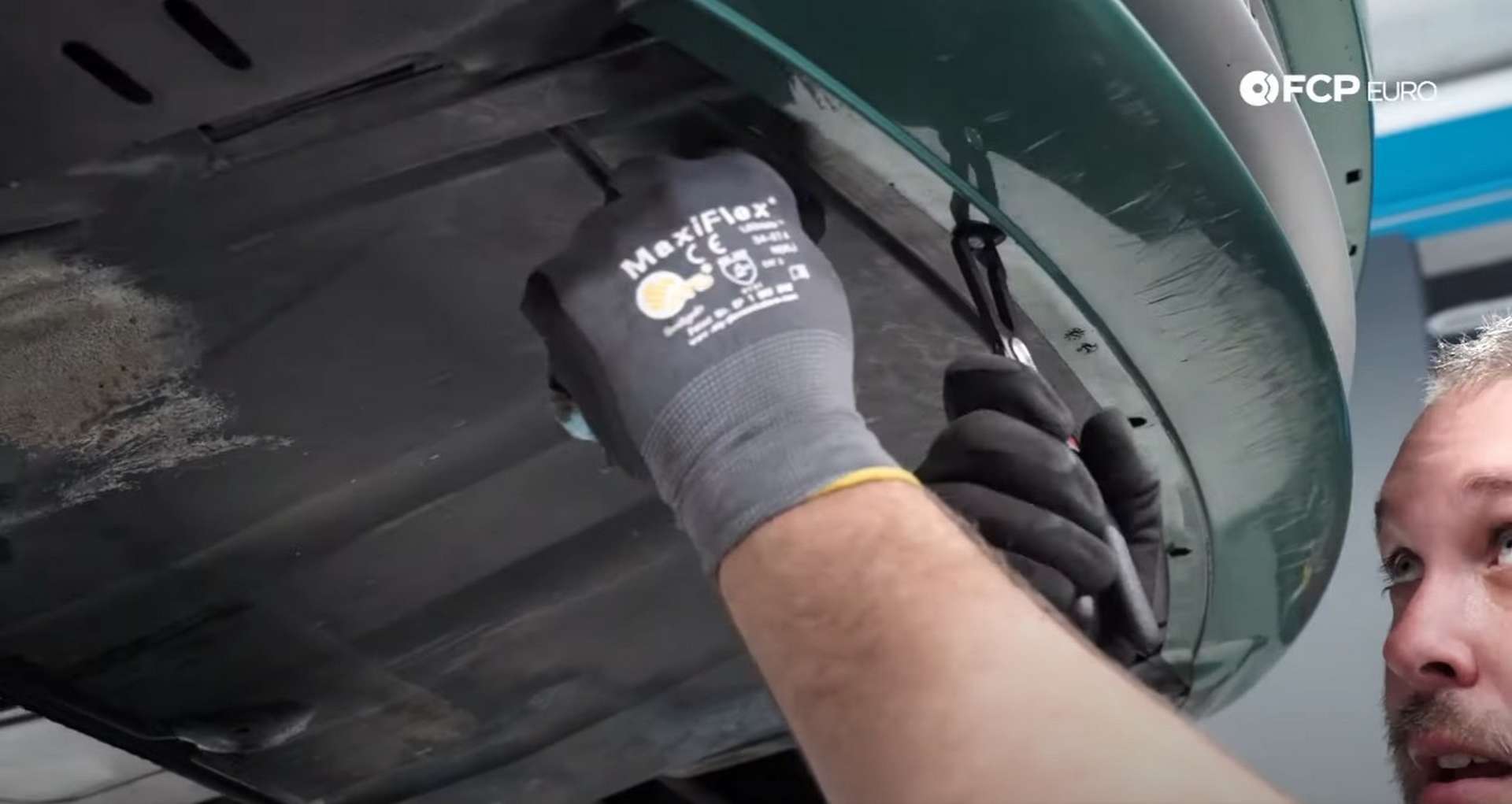 DIY BMW E46 Oil Filter Housing Gasket and VANOS Line Replacement removing the splash shield