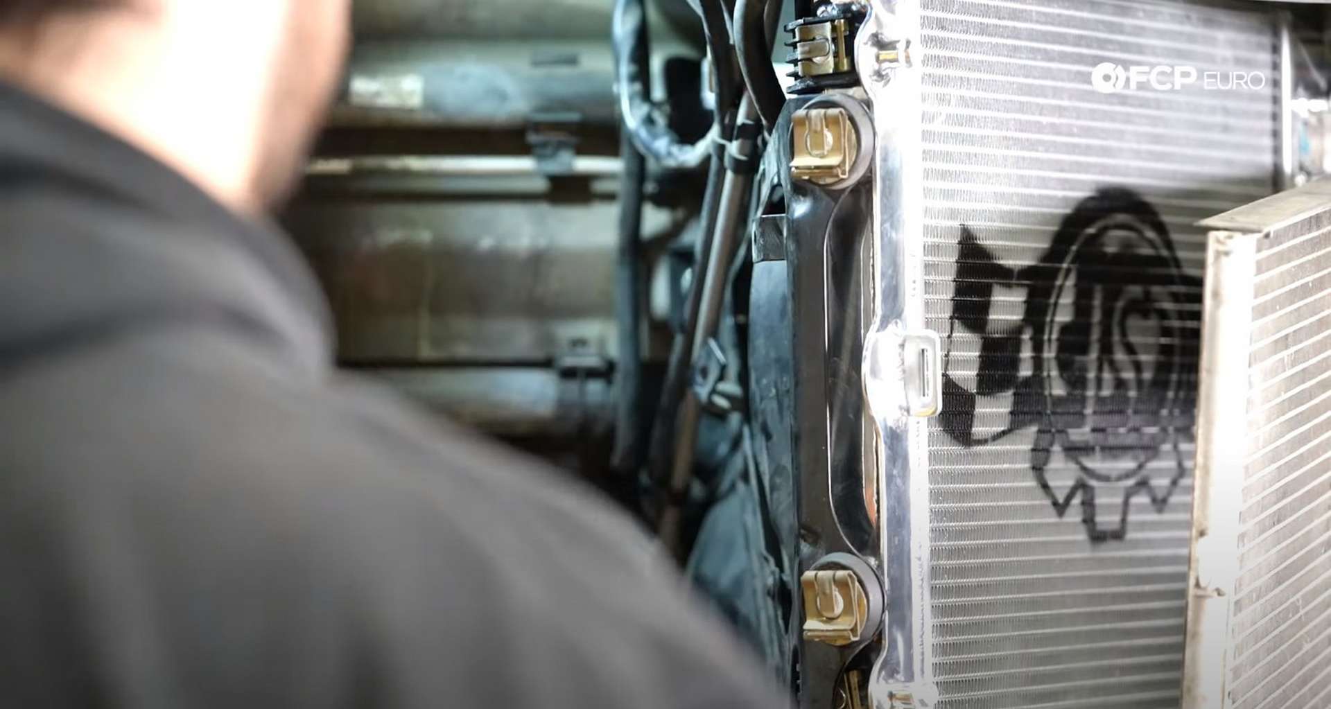 DIY Porsche 996 Radiator Replacement installed rad bracket retaining clips
