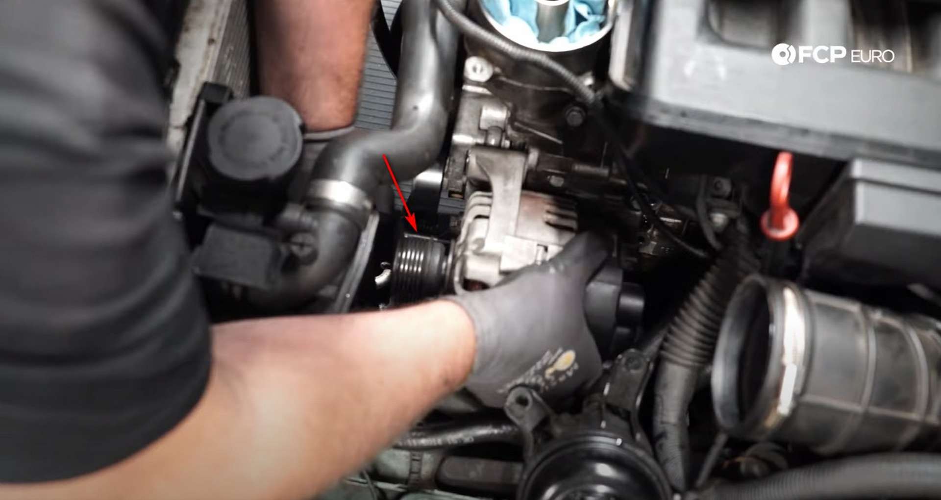 DIY BMW E46 Oil Filter Housing Gasket and VANOS Line Replacement installing the lower alternator bolt