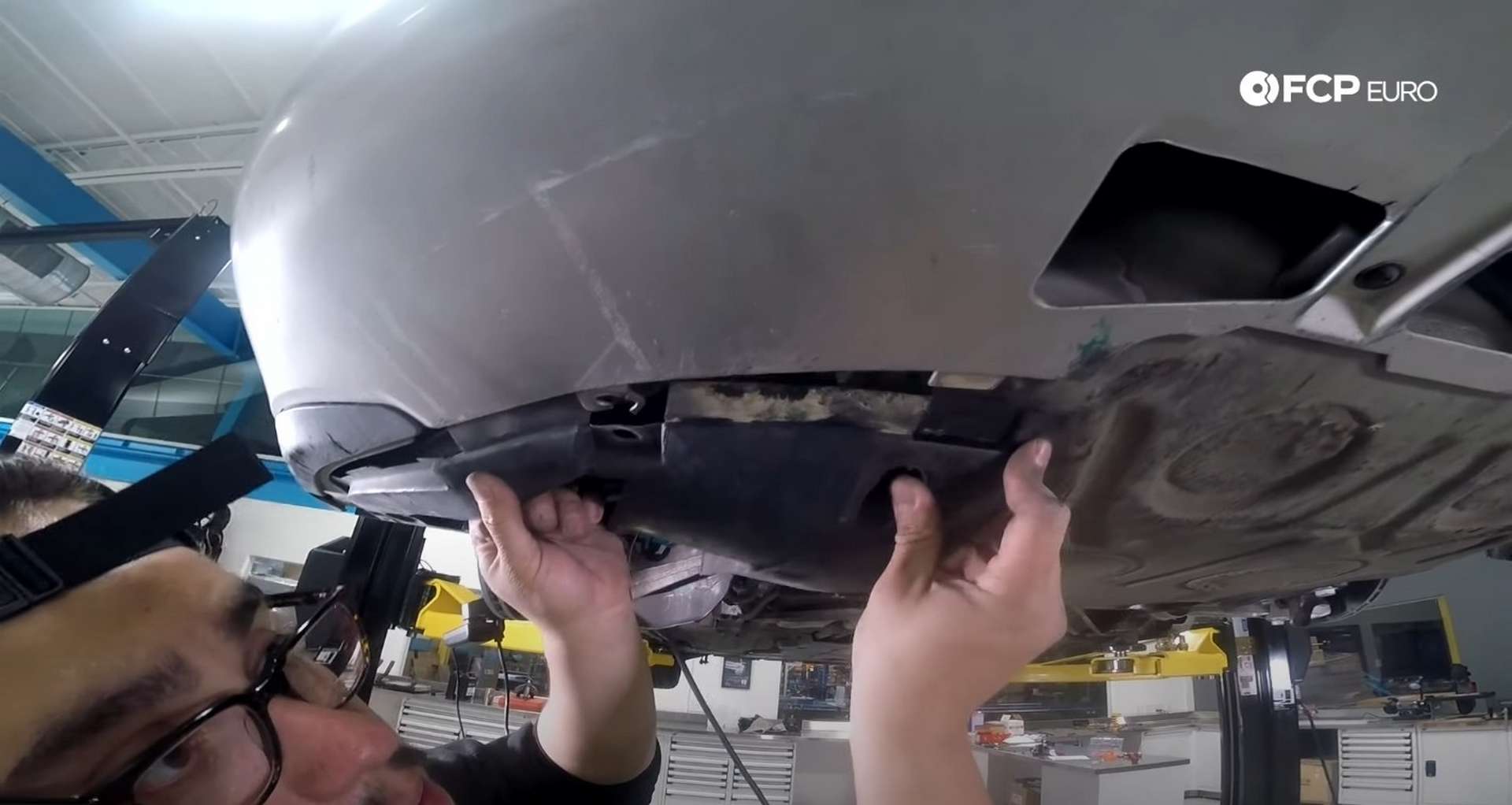 DIY Porsche 996 Radiator Replacement aligning the fender liner