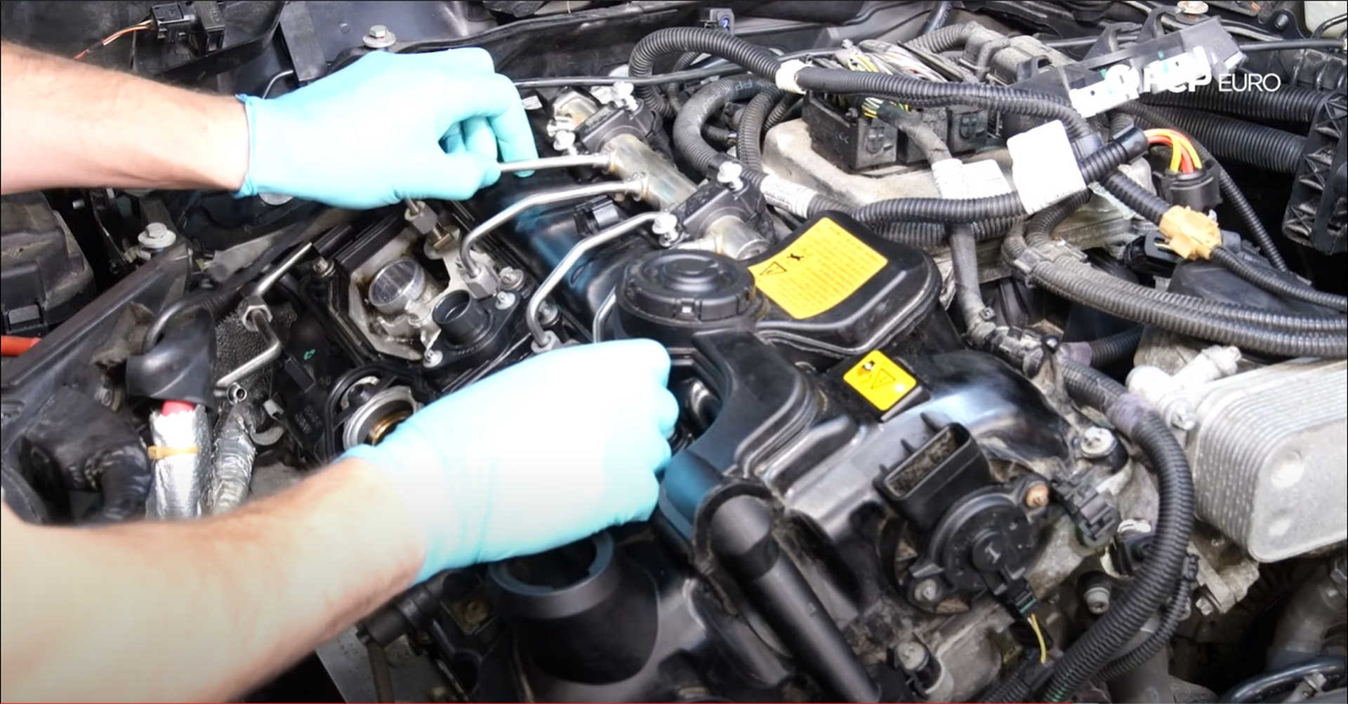 DIY BMW N20 Timing Chain Seating the fuel rail on the valve cover