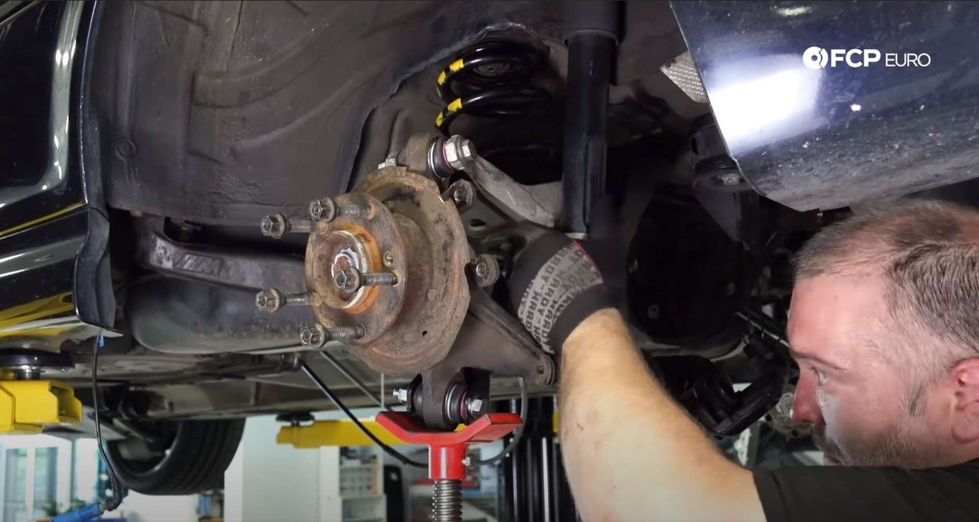 DIY E46 BMW M3 Rear Subframe Refresh Part 3 raising the knuckle to line up the lower shock bolt