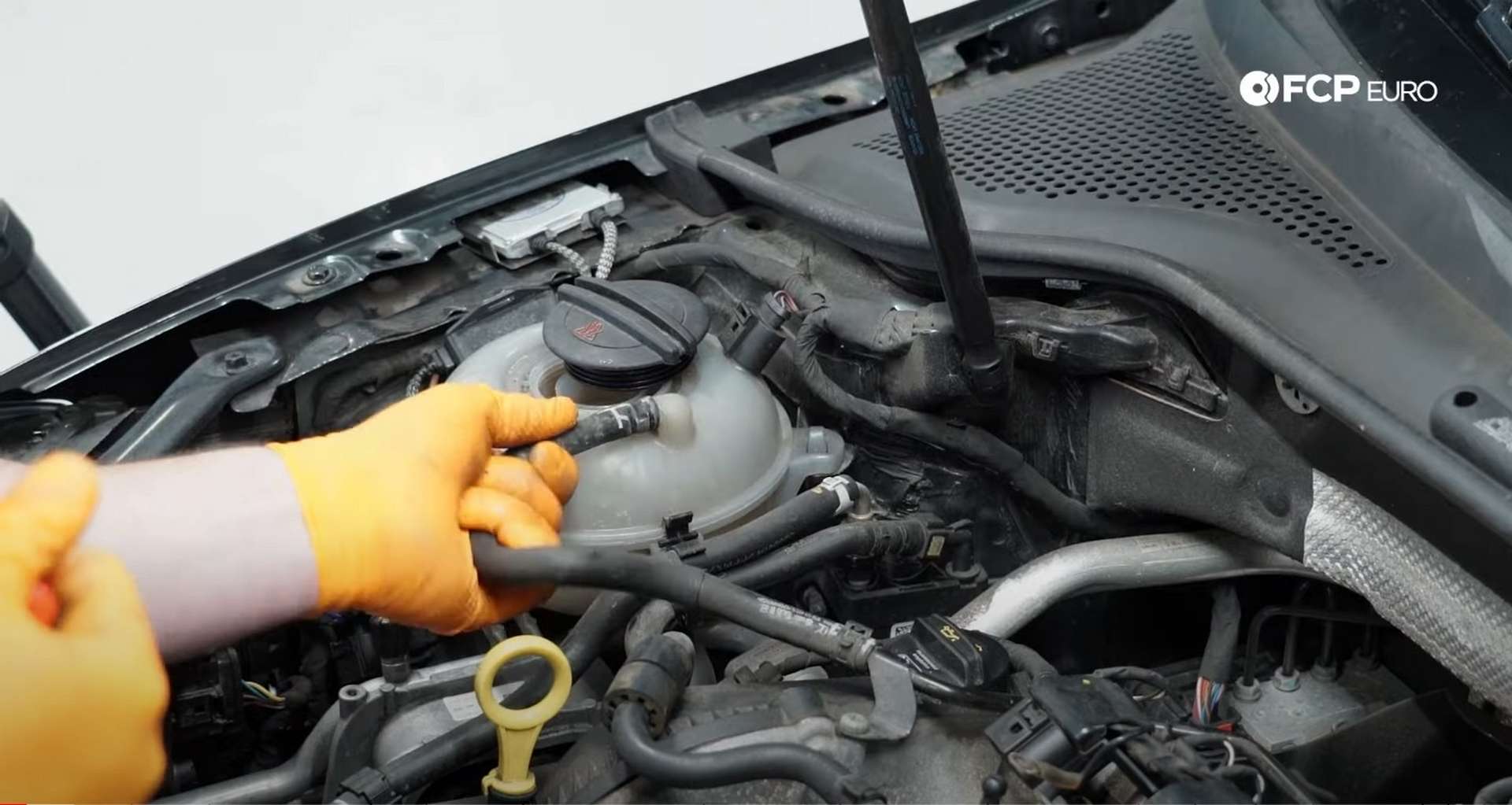 DIY MK7 VW GTI Turbocharger Upgrade removing the coolant line from the expansion tank