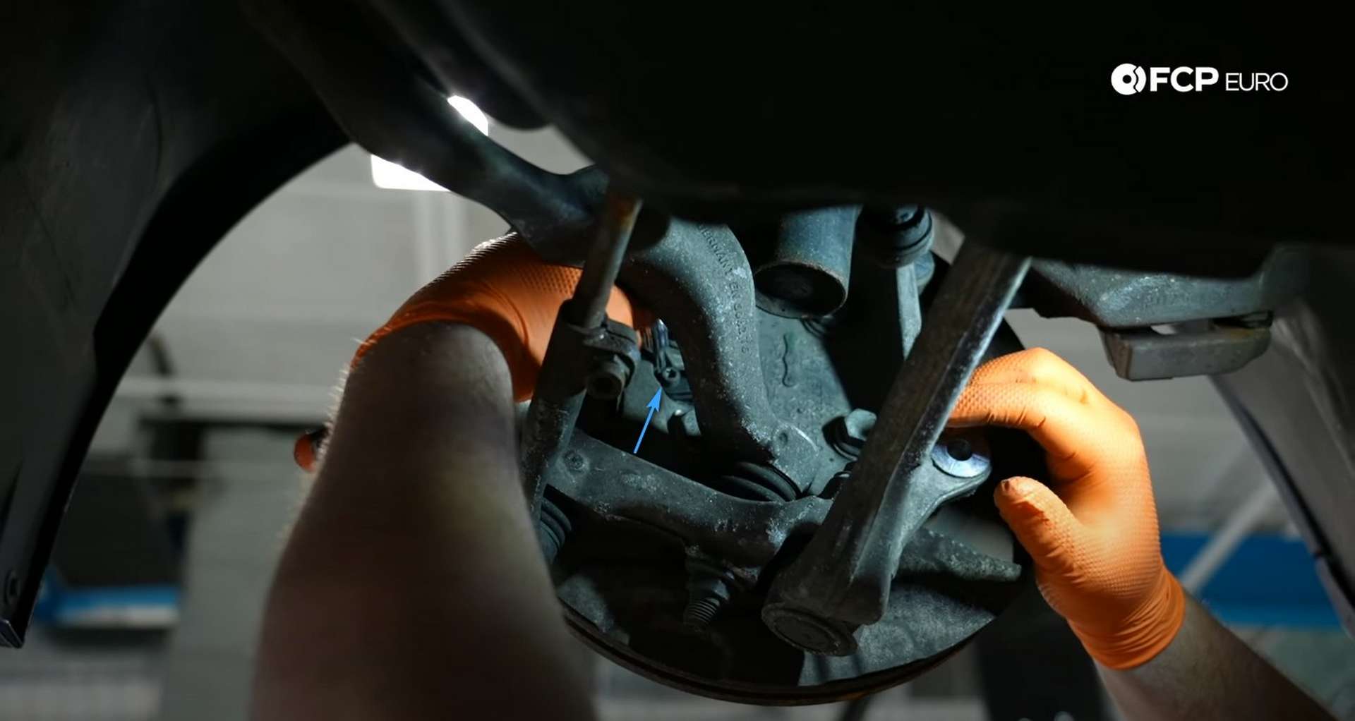 DIY BMW E90 Steering Knuckle Replacement removing the wheel speed sensor
