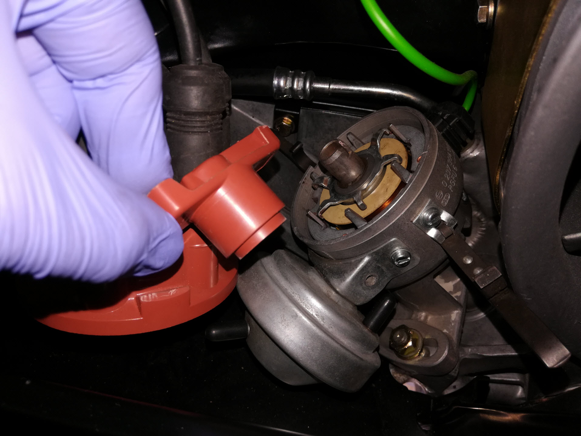 Air-cooled Porsche 911 distributor rotor removal.