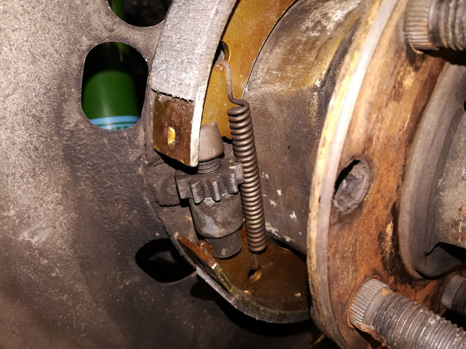 Air-cooled Porsche 911 parking brake spring reassembly.