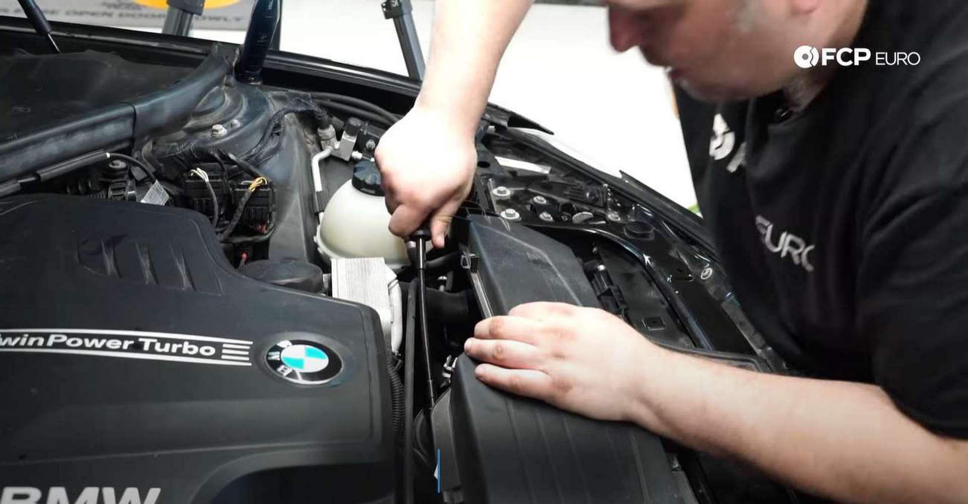 DIY BMW F30 Oil Filter Housing Gasket Replacement tightening the airbox hose clamp