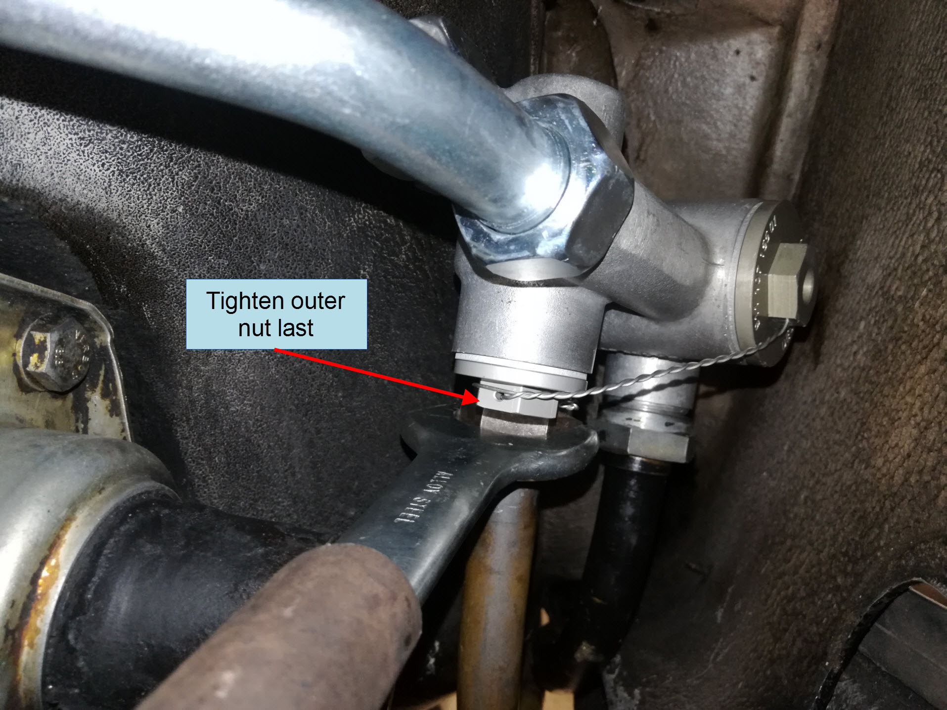 Air-cooled Porsche 911 hard oil line installation on external thermostat.