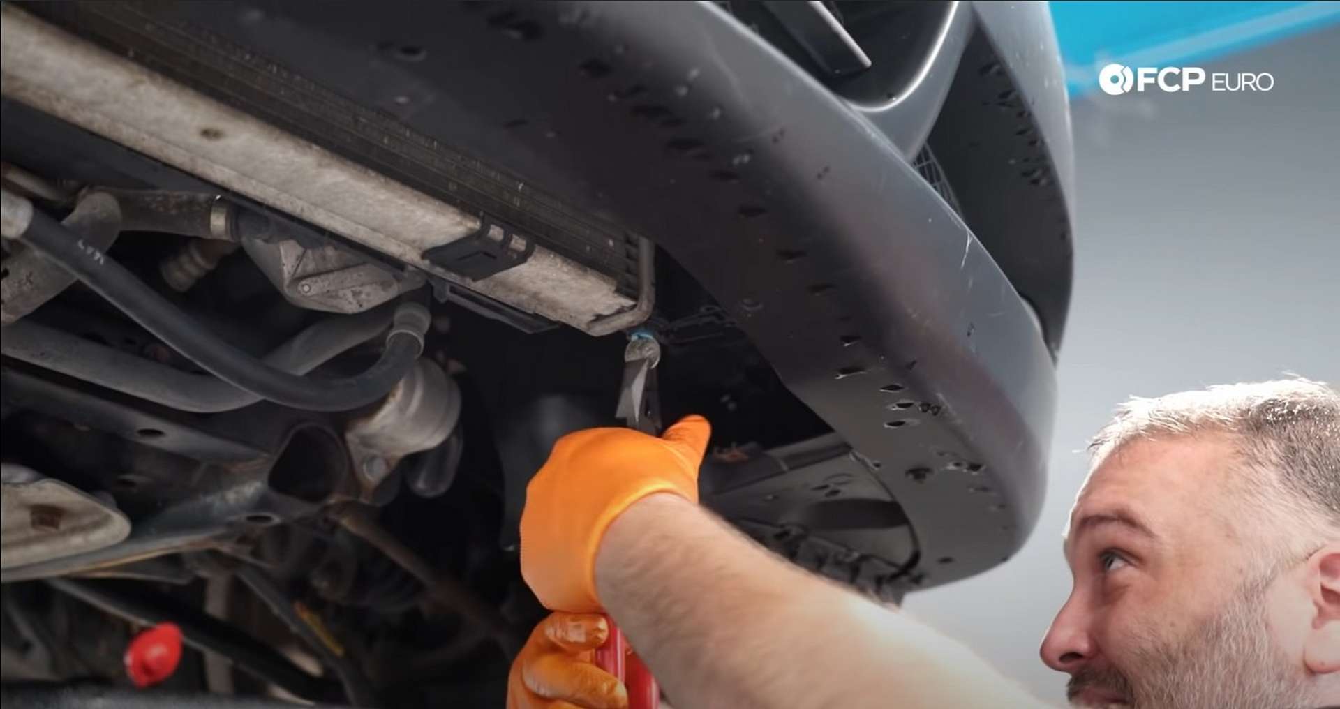 DIY BMW E9X Oil Filter Gasket Replacement removing the radiator's drain plug
