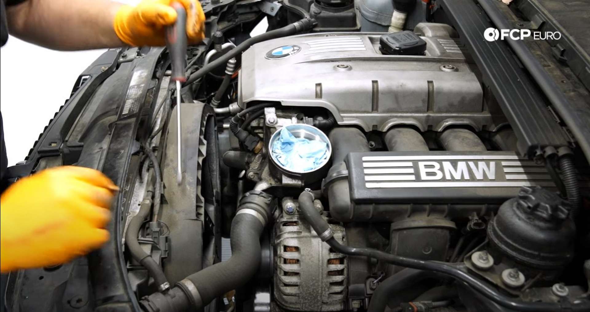 DIY BMW N52 Drive Belt Replacement disconnecting the fan's electrical connection