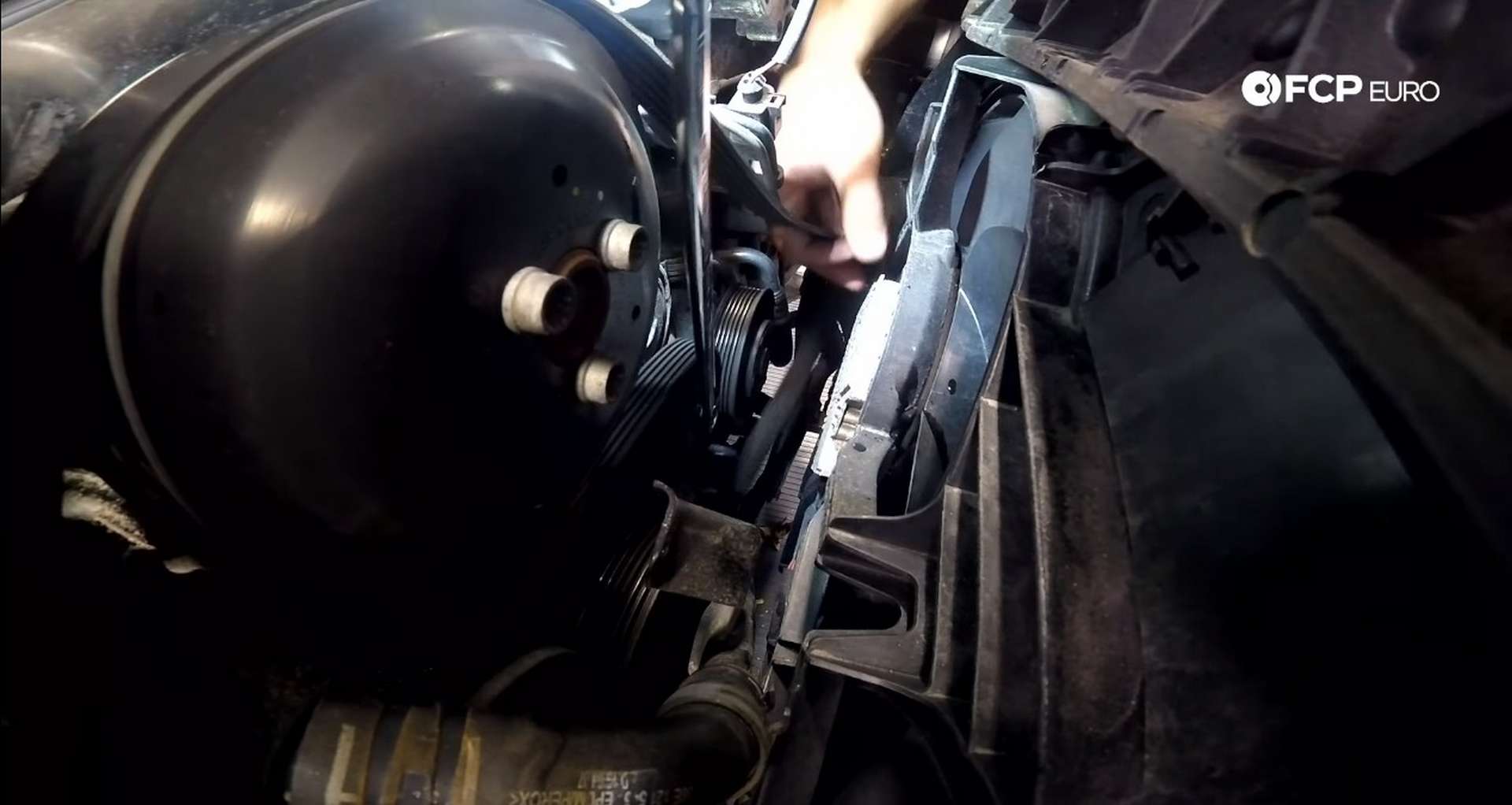 DIY Audi B8.5 Water Pump and Thermostat Replacement removing the tension from the accessory belt tensioner