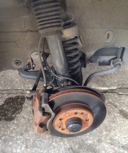 Front suspension after 5,000 miles. New control arm, spring, shock absorber, brake caliper, etc.