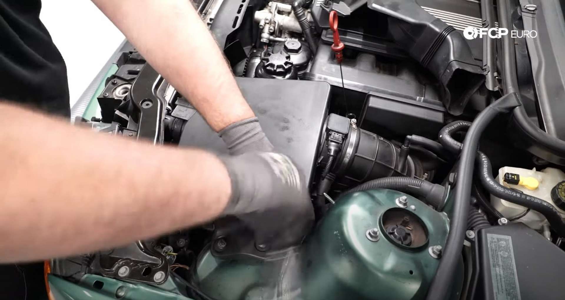 DIY BMW E46 Oil Filter Housing Gasket and VANOS Line Replacement reinstalling the airbox