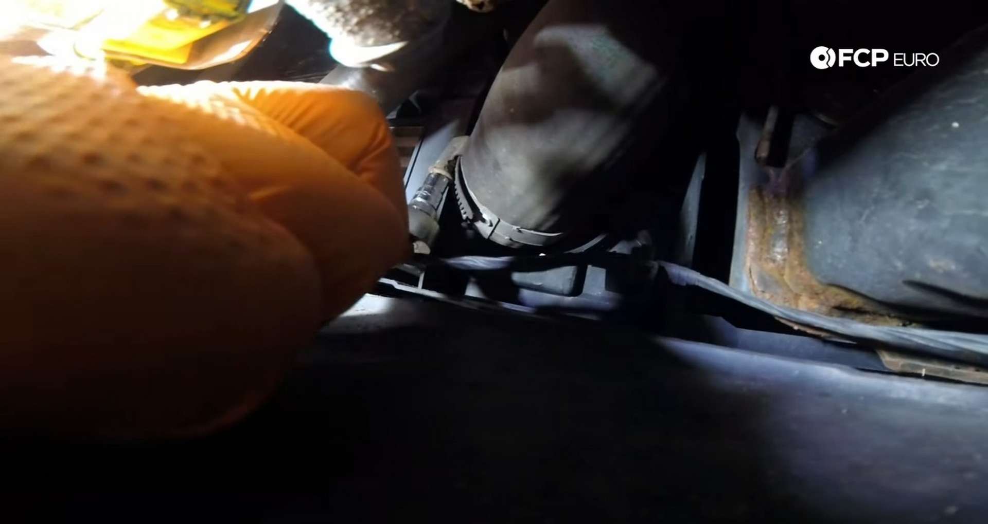 DIY MINI R56 Timing Chain Replacement loosening the charge pipe clamp