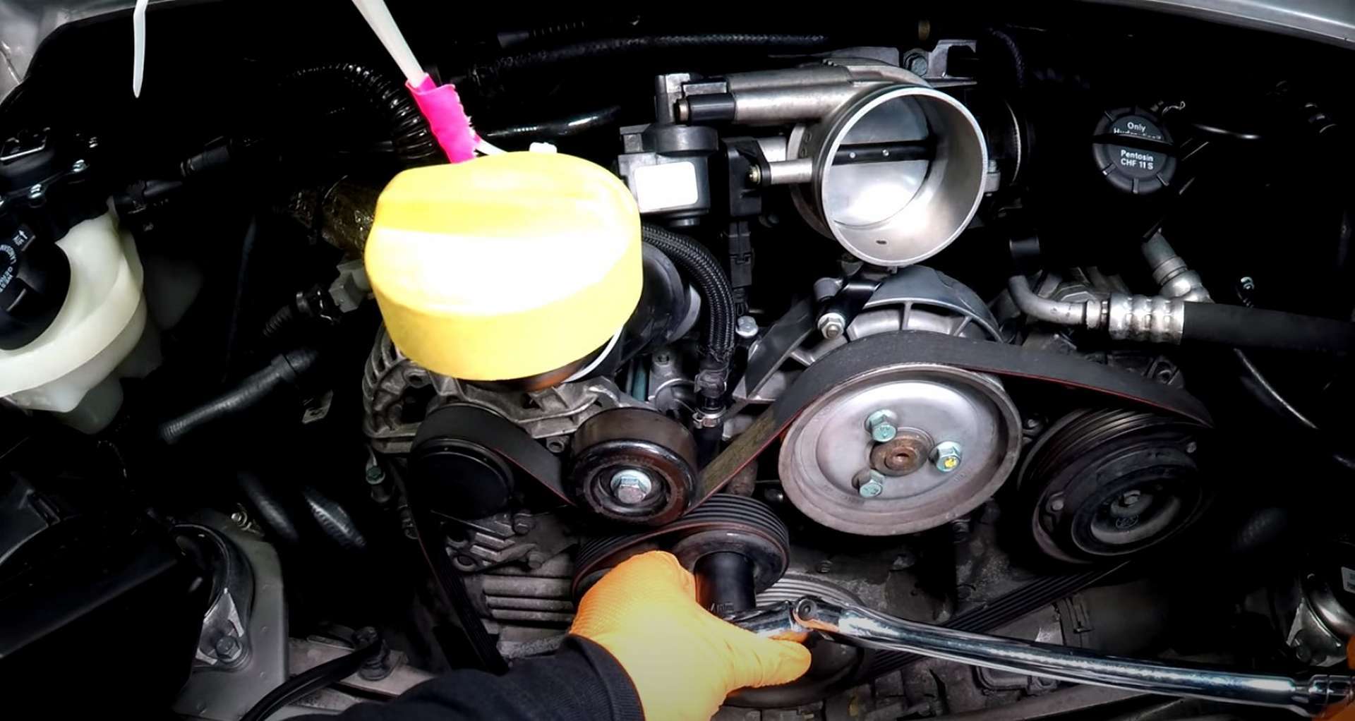 Porsche 996 Water Pump And Thermostat Replacement removing the old belt
