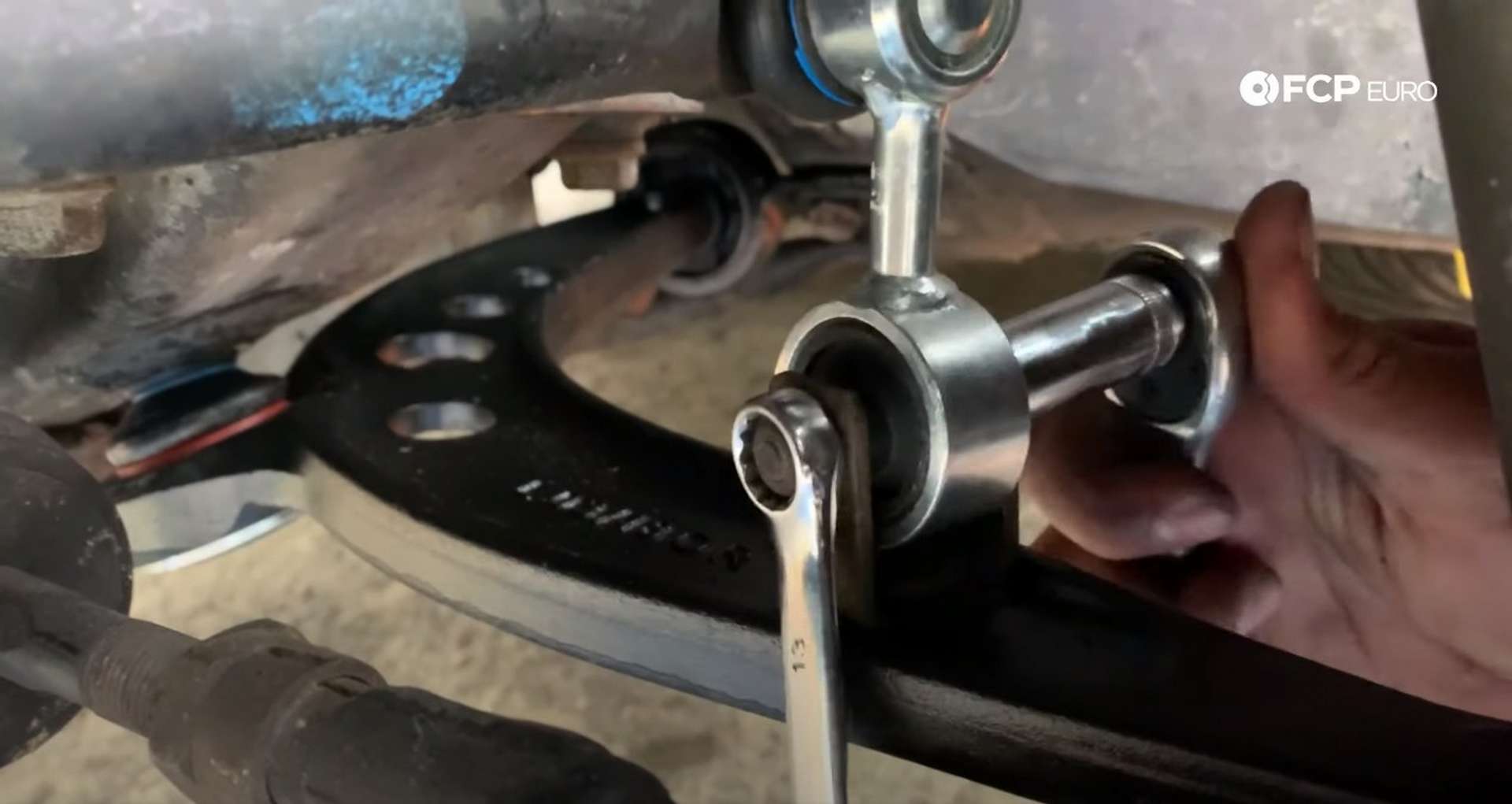 DIY BMW E36 Control Arm and Bushings securing the endlink to the bracket
