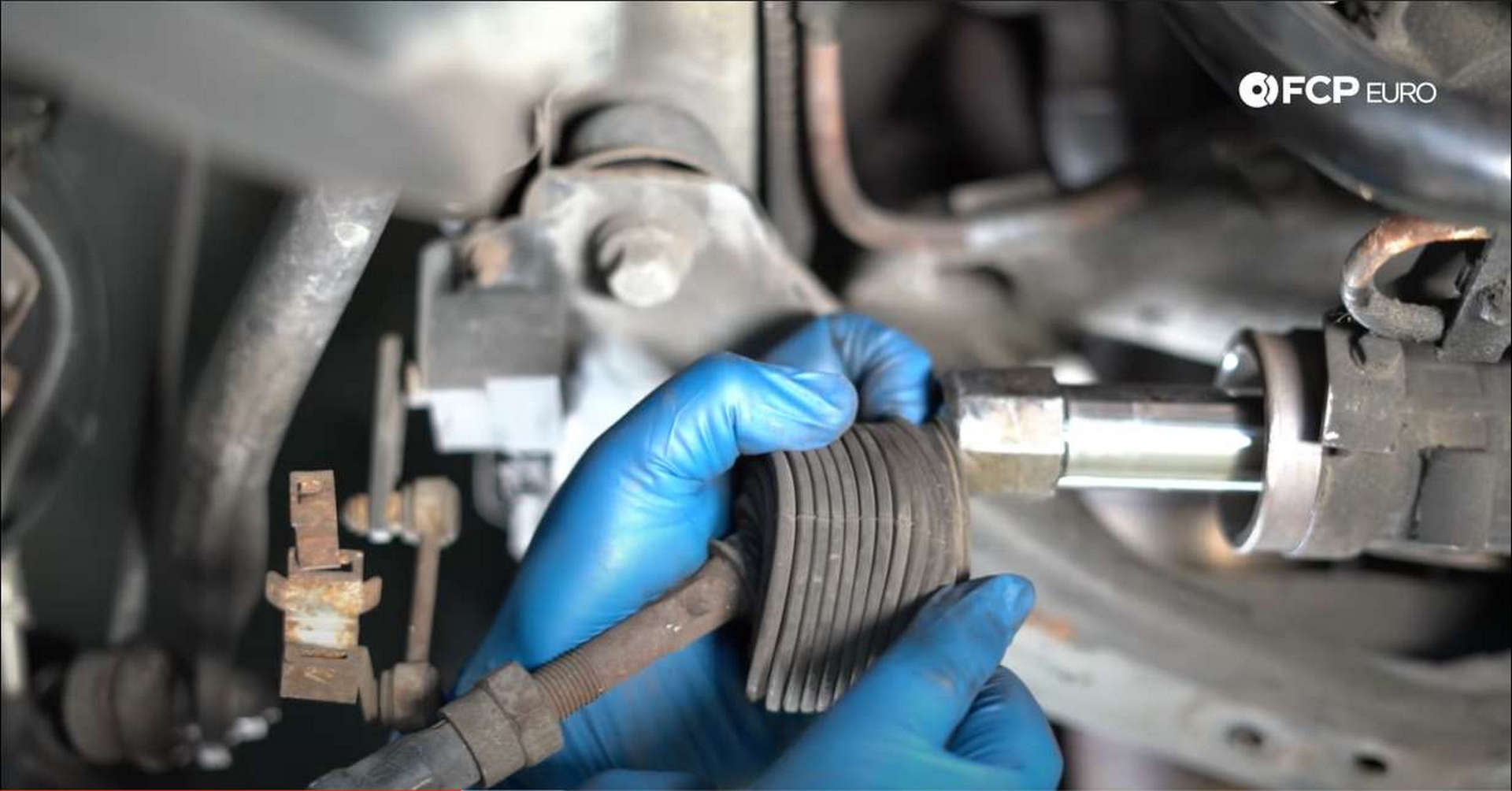 DIY BMW Front Suspension Refresh exposing tie rod nut