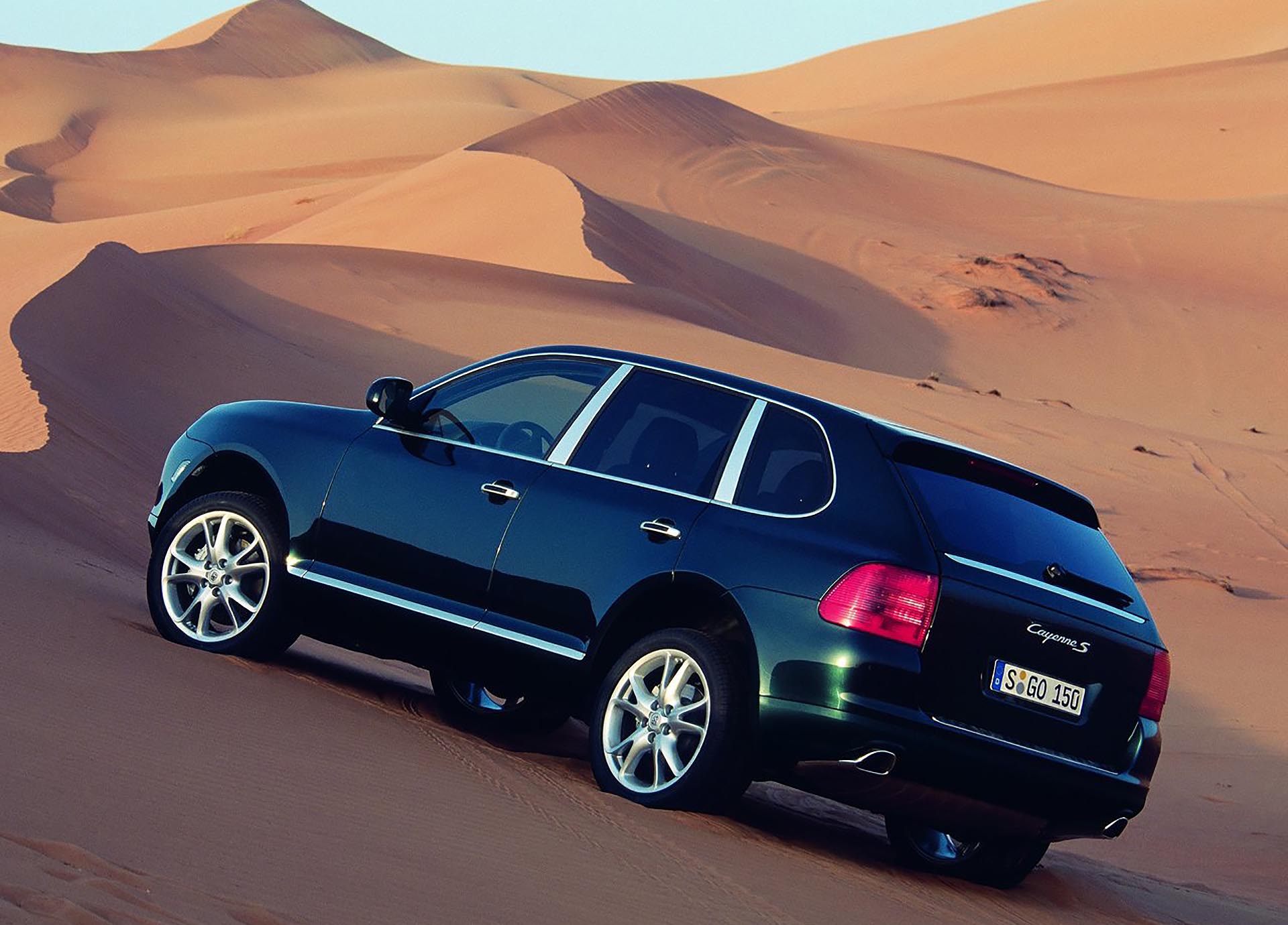 955 Porsche Cayenne S rear profile sand dunes