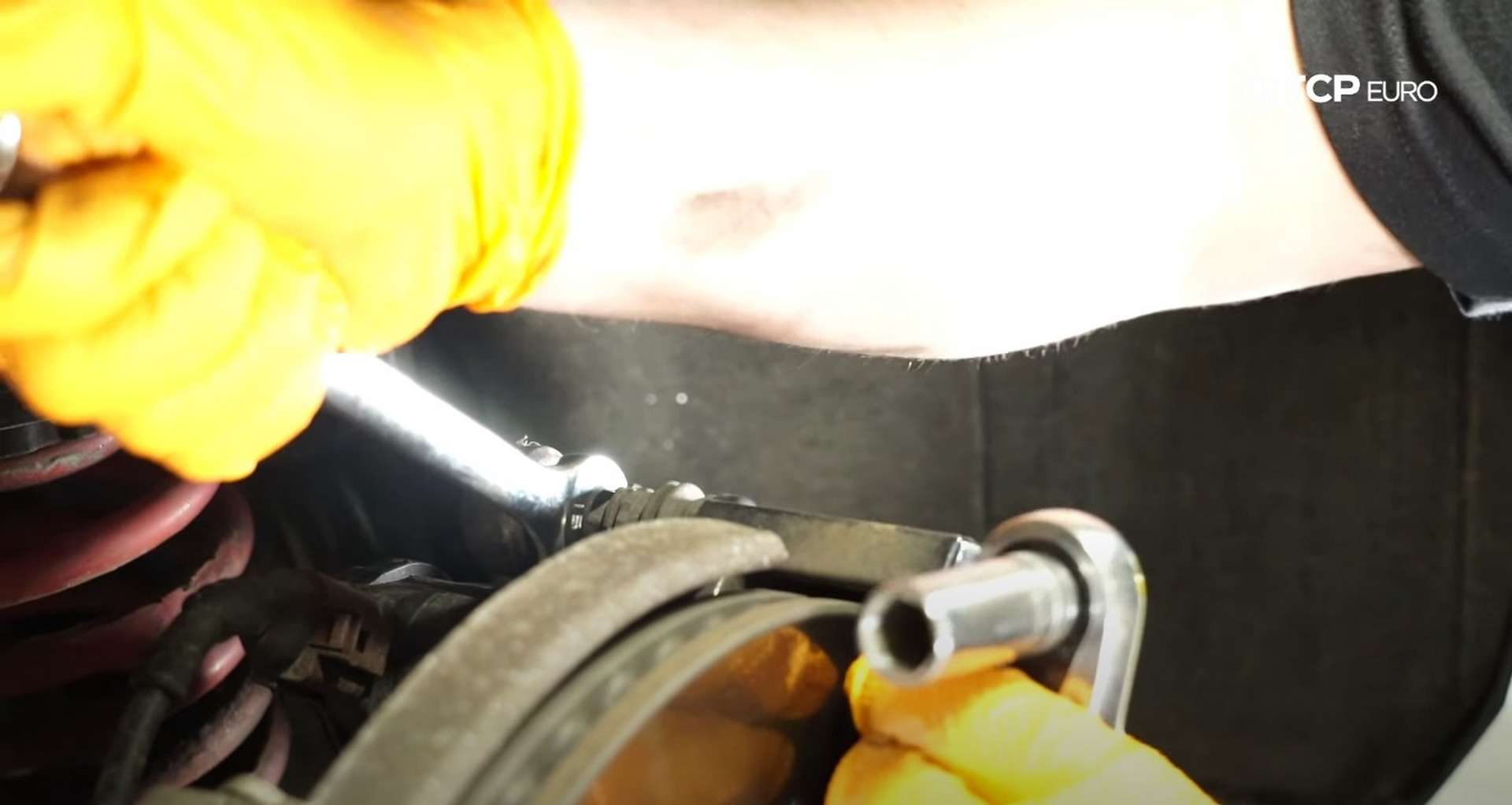 DIY Audi B8 S4 Rear Brake Service counter-holding the caliper
