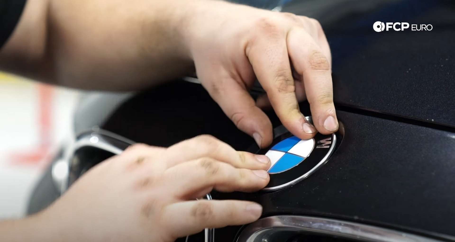 DIY BMW F30 Roundel Replacement pressing on the new emblem
