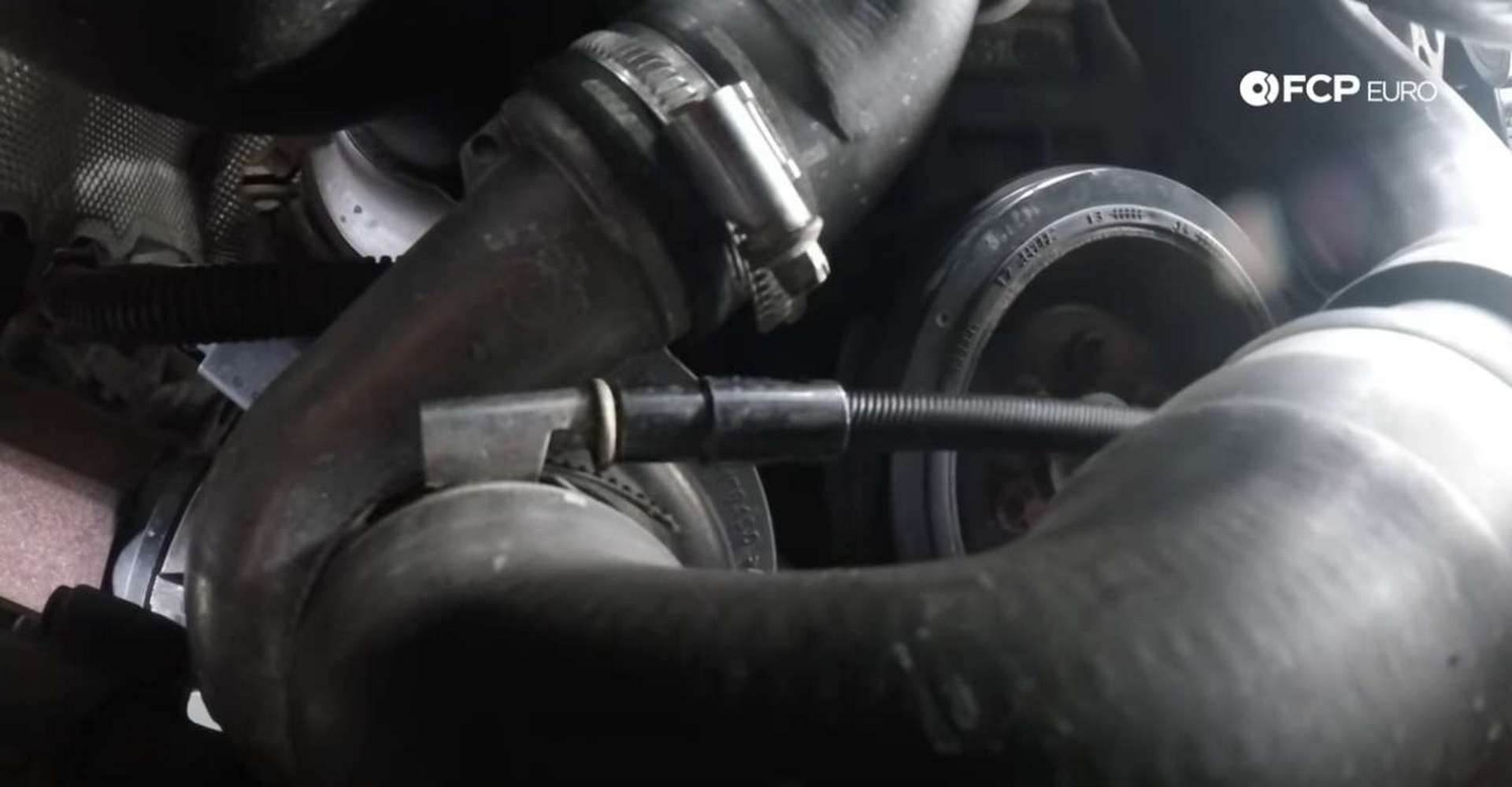 DIY BMW F30 Oil Filter Housing Gasket Replacement loosening the water pump hose clamp