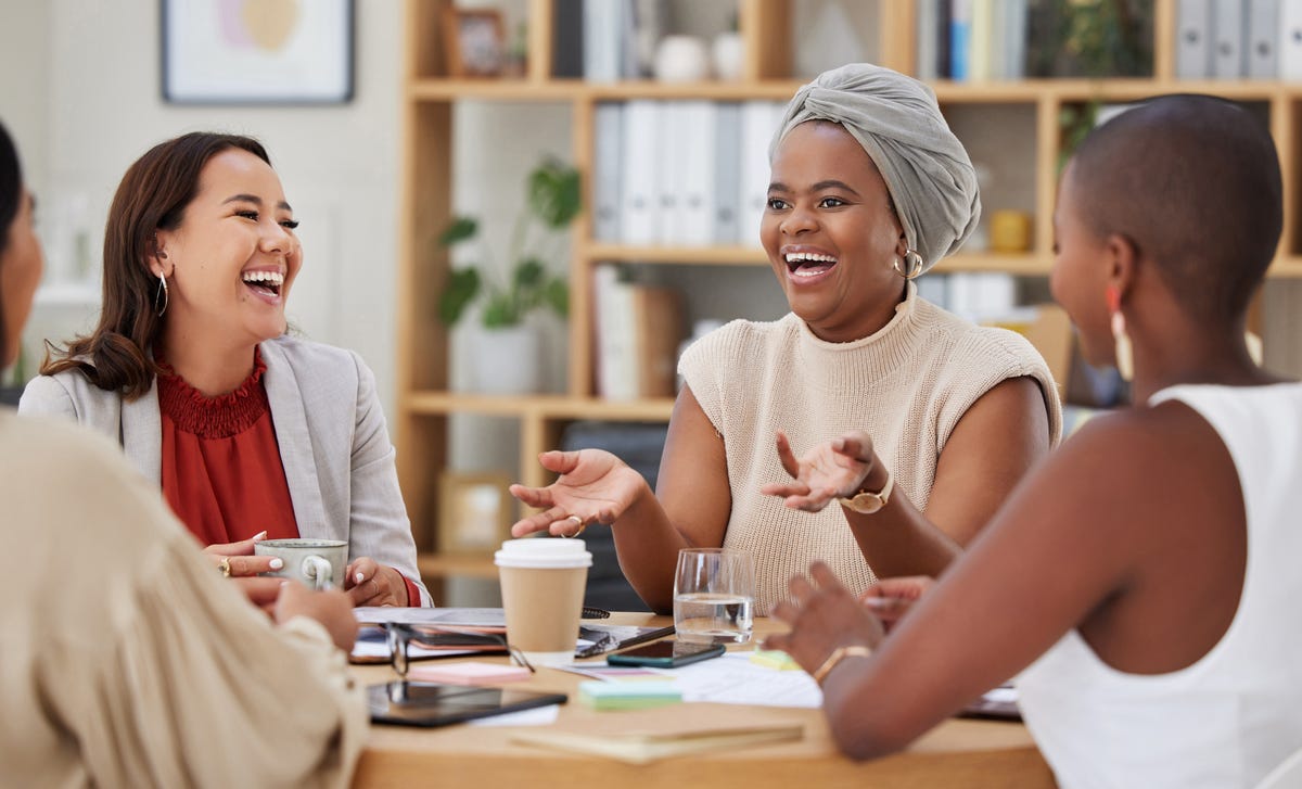 Women talking to each other happily during their English lesson with Berlitz in Calgary