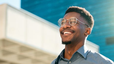 Man smiling on his way to the Ottawa Berlitz language center to learn languages