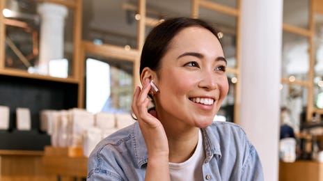 Woman joining an online language class from her phone in Toronto with Berlitz