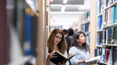 students in the library learning with the berlitz method