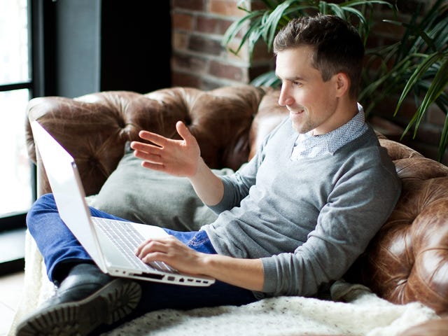 man speaking during an online group class at home