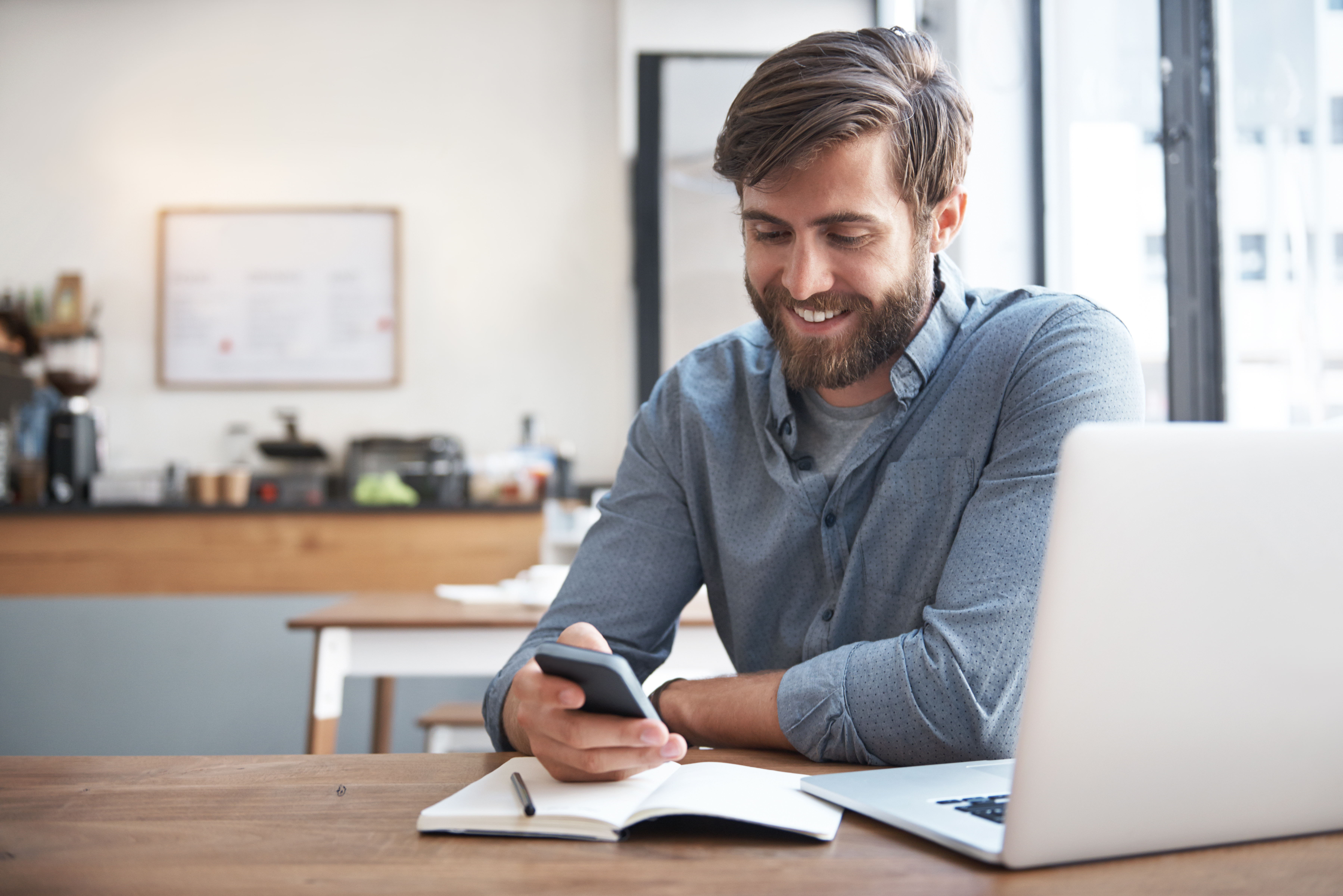 man attending his online language classes on his phone