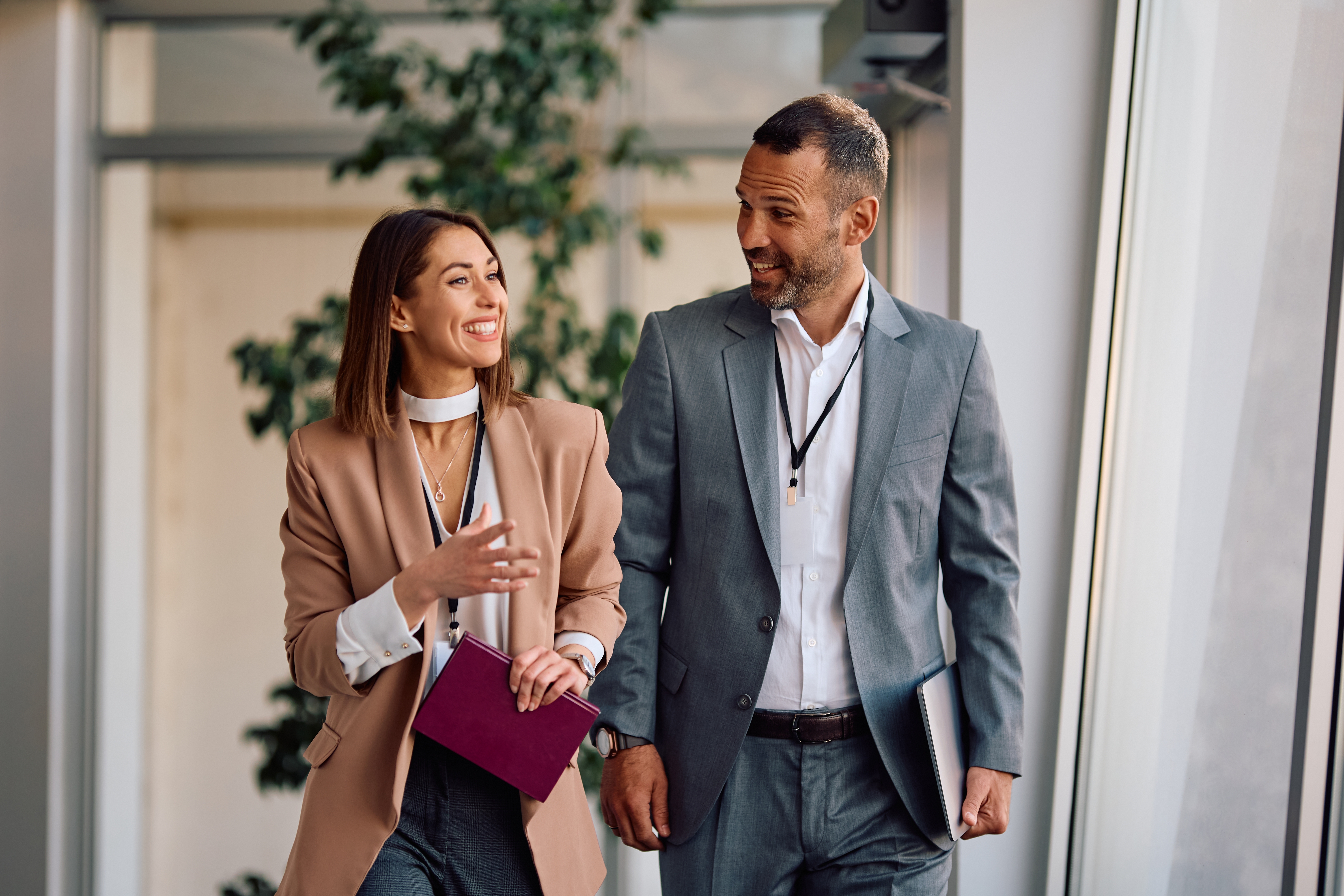 Woman talking to her coworker in a foreign language during a business trip