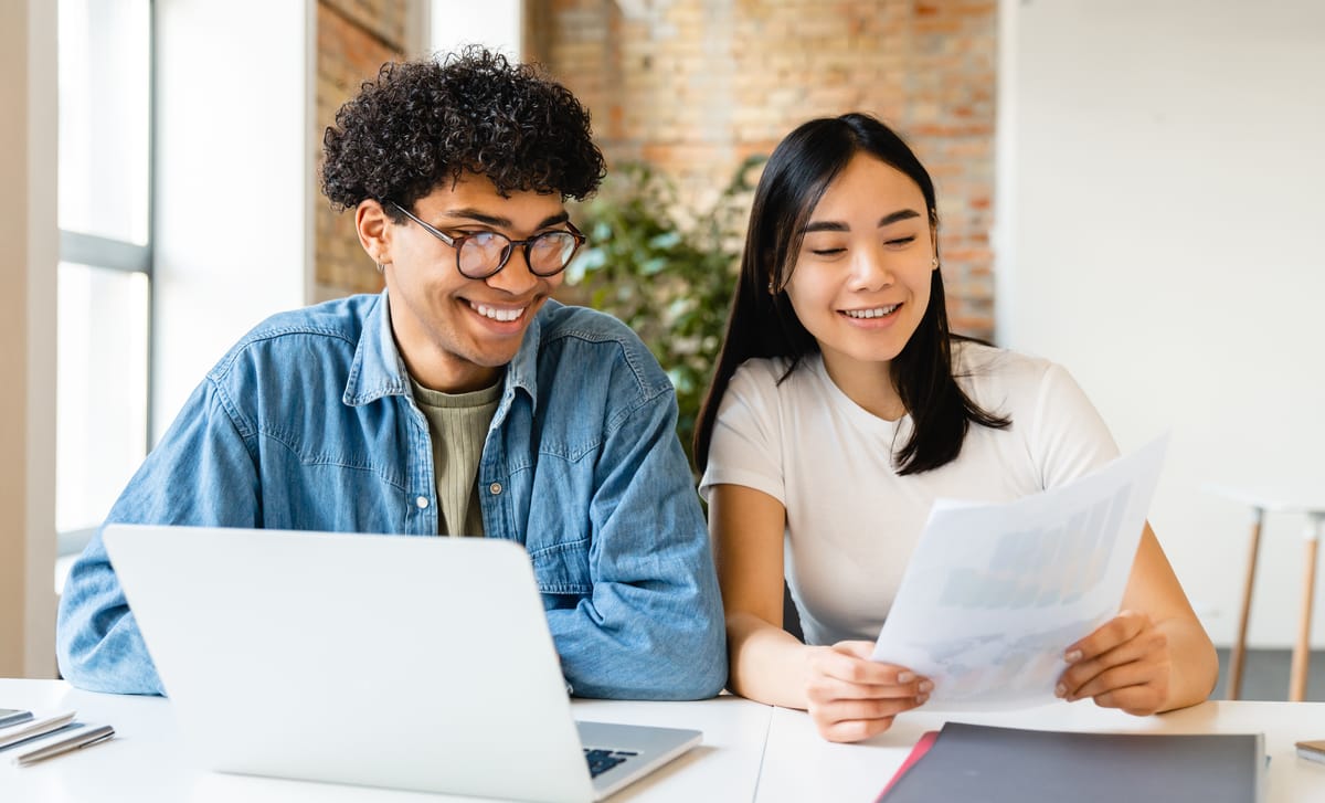 Man and woman discussing TEF preparation after their online class with Berlitz Edmonton