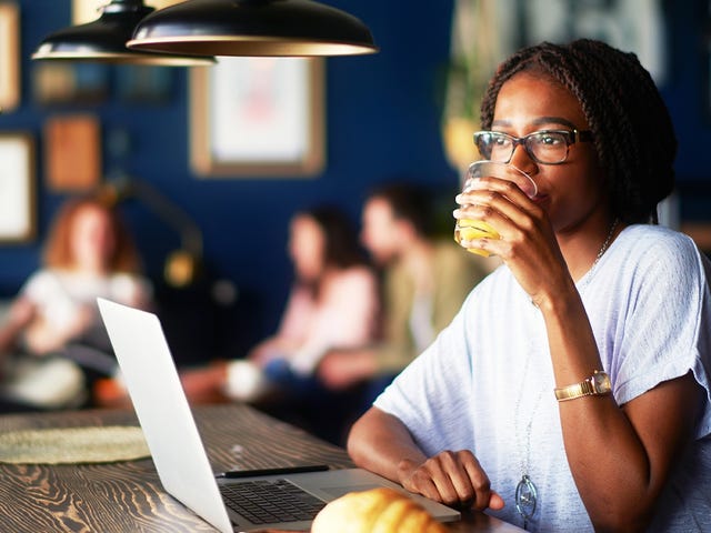 woman studying for her online private classes in a cafe