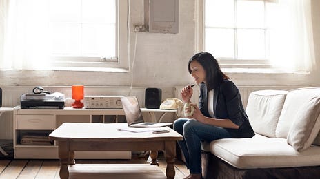 woman attending an online intensive language class in her livingroom